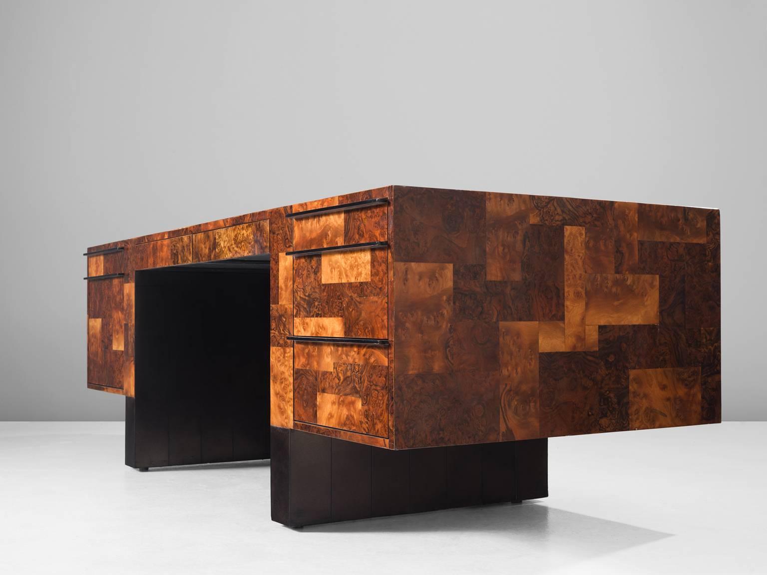 'City Scape' Desk, in different types of wood, by Paul Evans, United States 1970s.

Large desk with a patchwork pattern of different sorts of wood. The design is simplistic with straight lines and cubic forms. The different sorts of wood and