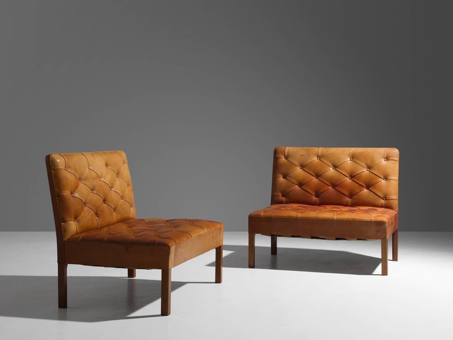 Set of two settee's model 4698, in leather and oak, by Kaare Klint for Rud Rasmussen, Denmark 1933. 

This set of free-standing sofa's is one of the most iconic designs by Kaare Klint. They show a mix of functional, minimalist and at the same time