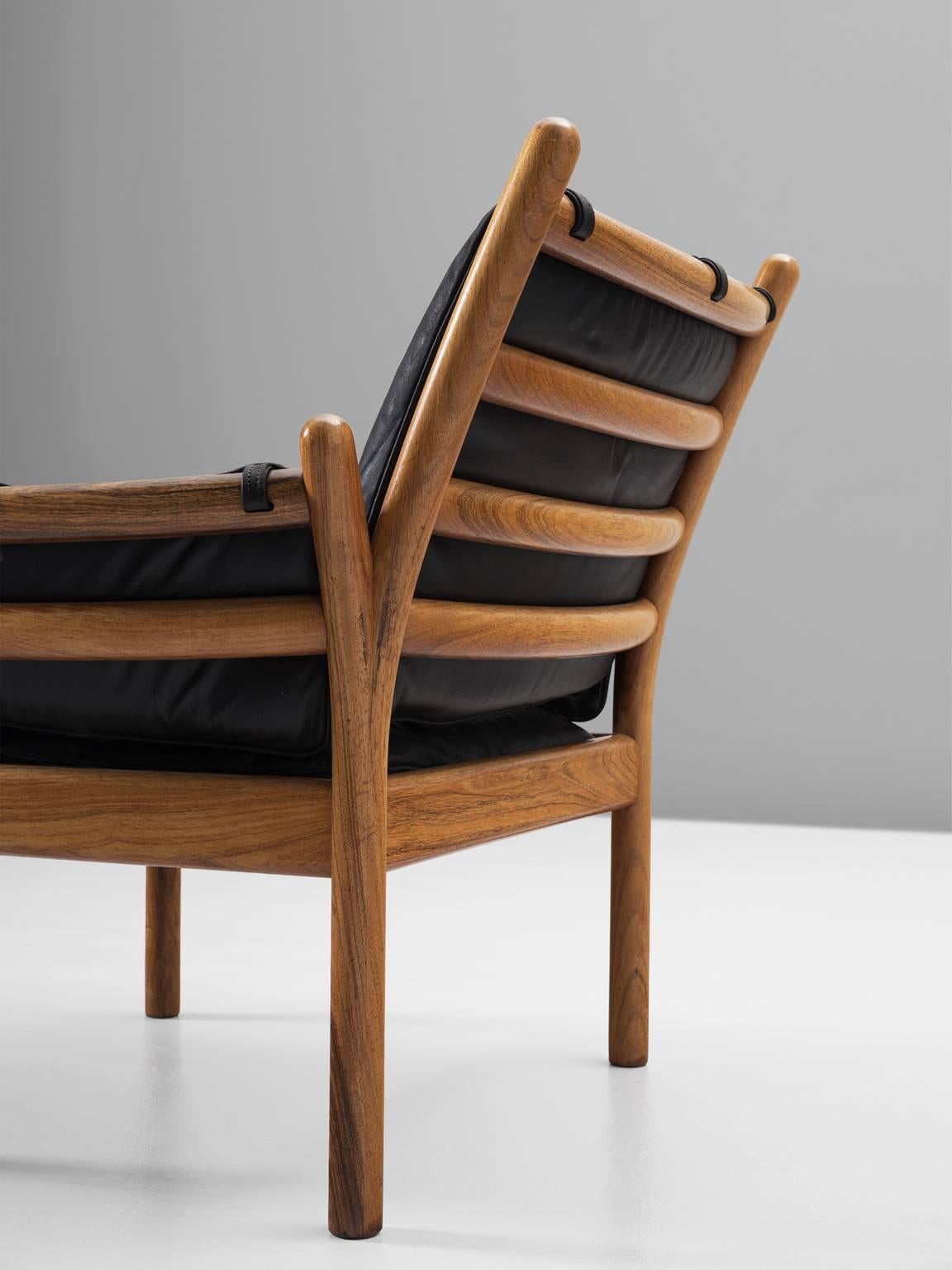 Mid-20th Century Illum Wikkelsø Solid Rosewood Lounge Chair and Ottoman