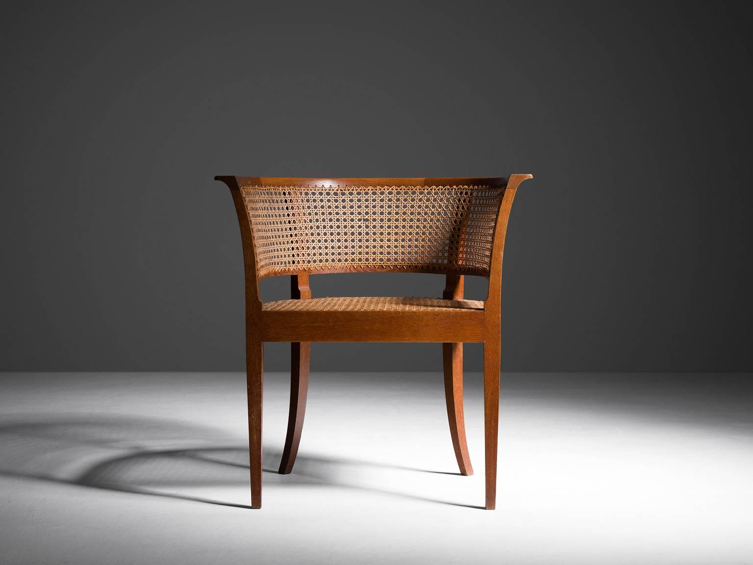 Faaborg chair 'KK96620', in oak and cane, by Kaare Klint for Rud Rasmussen, Denmark 1914. 

Faaborg chair in oak and cane, this specific item was produced in 1930 and makes it into an exceptional early exemplar.  
This chair was specially