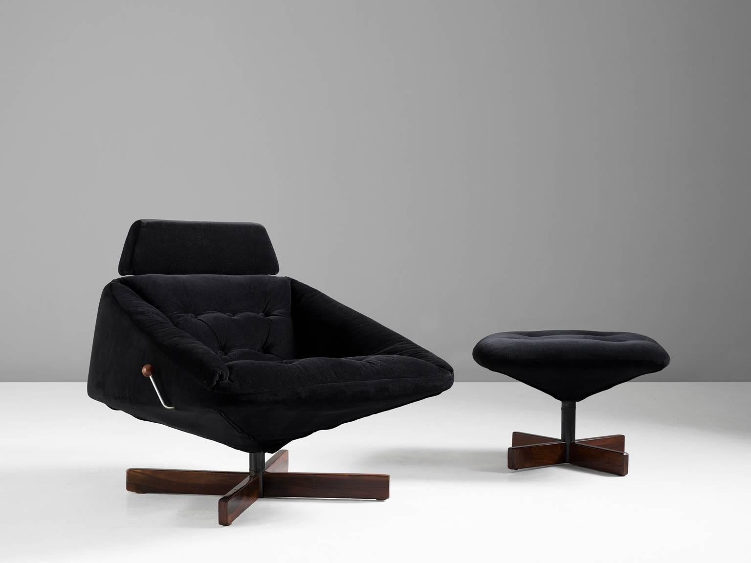 Lounge chair, in wood, metal and fabric, by Percival Lafer, Brazil, 1970s. 

Swivel lounge chair with adjustable headrest and footstool in black velvet mohair-like upholstery. The X-shaped leg of Brazilian wood makes a nice combination with the