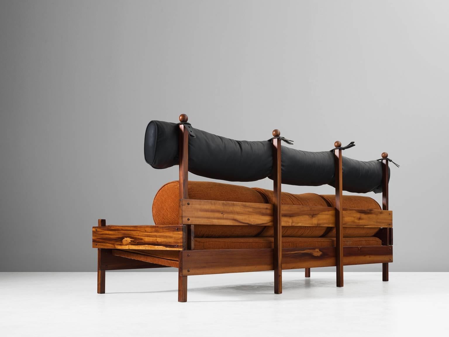 Sofa 'Tonico', in rosewood, fabric and faux-leather, by Sergio Rodrigues for Oca, Brazil, 1960s.

Three-seat sofa in solid rosewood and colorful orange upholstery. Rodrigues designs are often characterised by a sturdy frame of solid rosewood