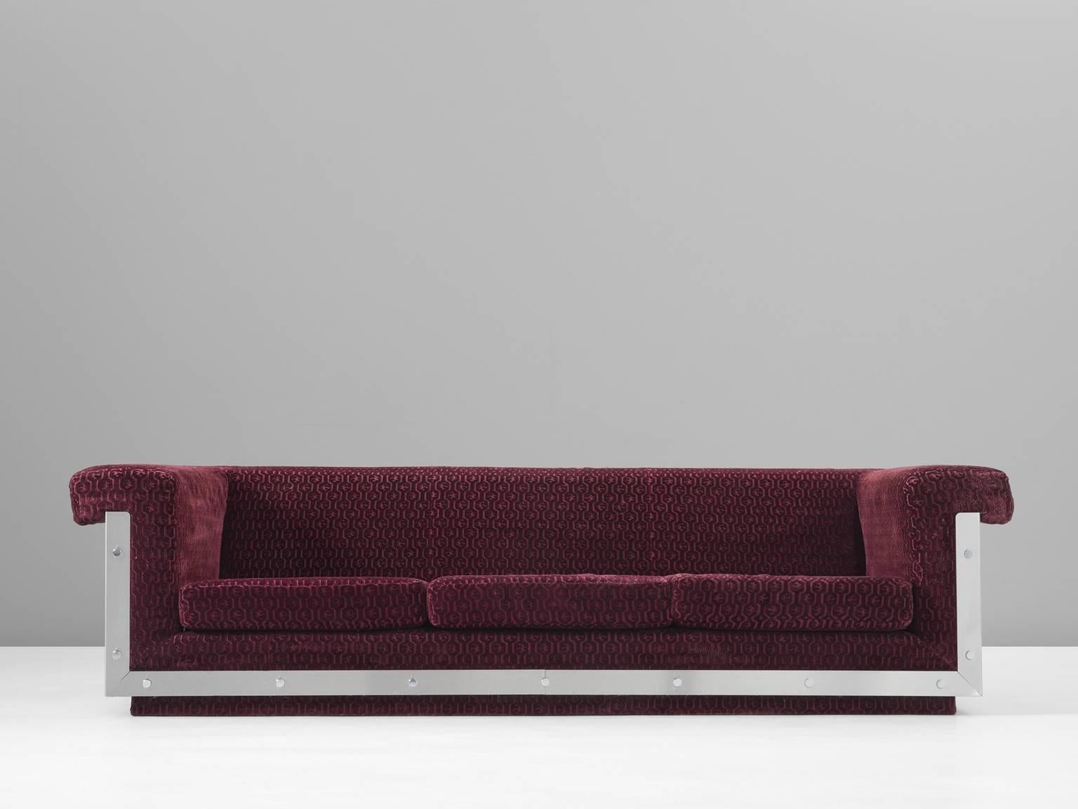 Sofa, in steel and fabric, France, late 1960s.

Modern and sleek sofa in stainless steel and velvet pattern upholstery. This sofa has a very strong expression, by the shimmering steel outside. This Industrial base holds the cushions, upholstered