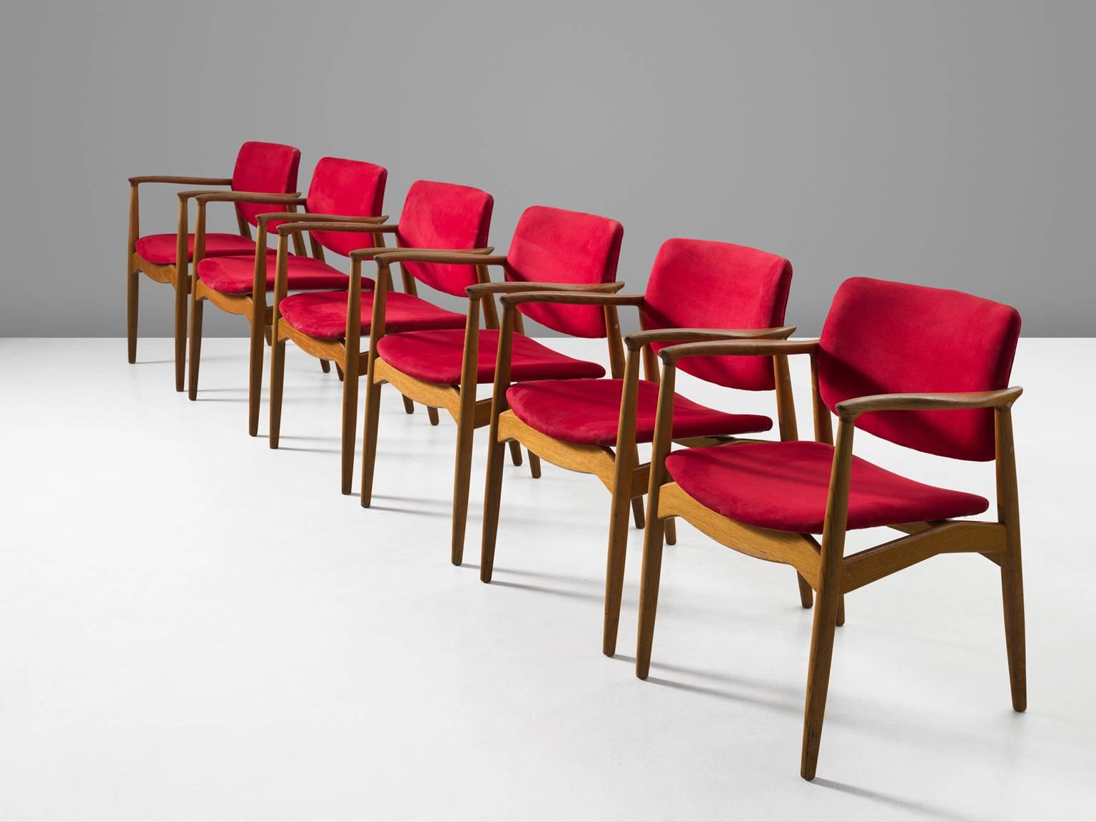Eric Buch for Ørum Møbler, set of six 'Captains' armchairs, in oak and faux-leather, Denmark, 1957. 

Set of six sculpted dining chairs in solid oak. These chairs show the characteristics of the well-known model 50 by Erik Buck. Yet this model has a
