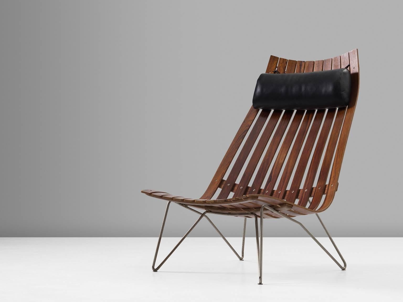 Lounge chair model Scandia, in rosewood and metal, by Hans Brattrud for Hove Mobler, Norway, circa 1957. 

Elegant and modern lounge chair in warm rosewood. This slatted chair shows an interesting 'hairpin' frame of one piece of bent metal. The