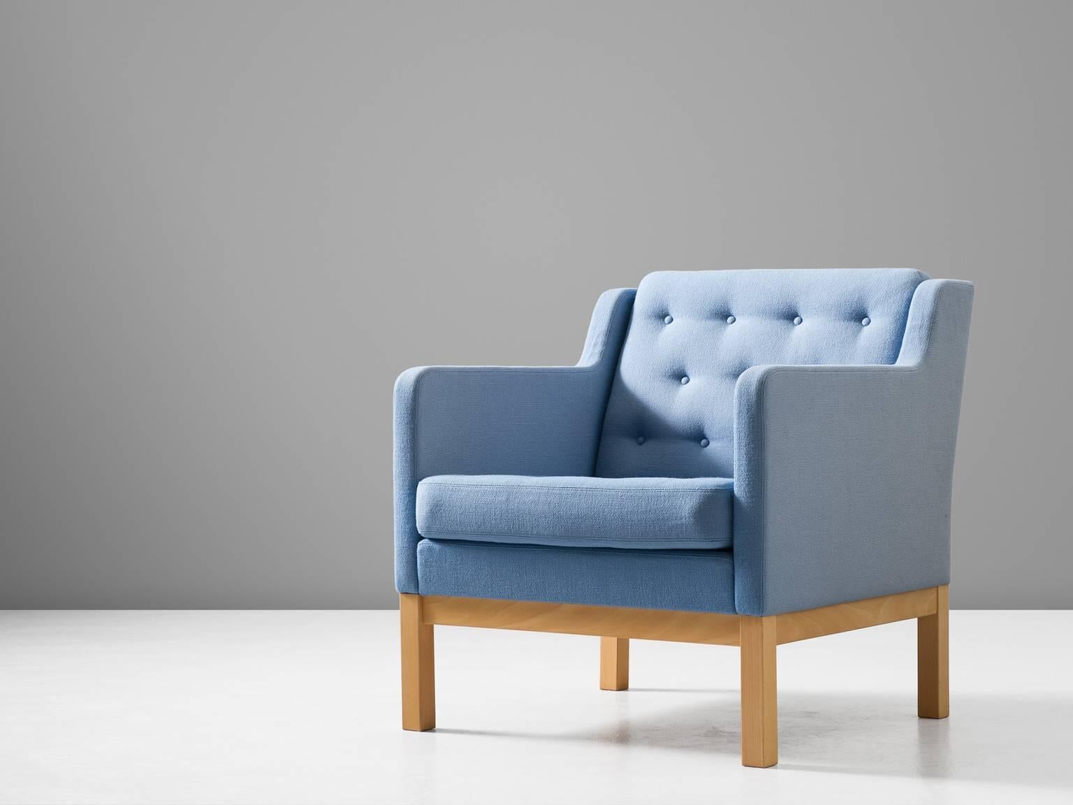 Armchair model EJ 315-1, in and fabric, by Erik Jorgensen for Erik Jørgensen Møbelfabrik, Denmark, circa 1972.

Characteristic Scandinavian lounge chair with a beech wooden frame and soft blue fabric upholstery. The design is simplistic and cubic.