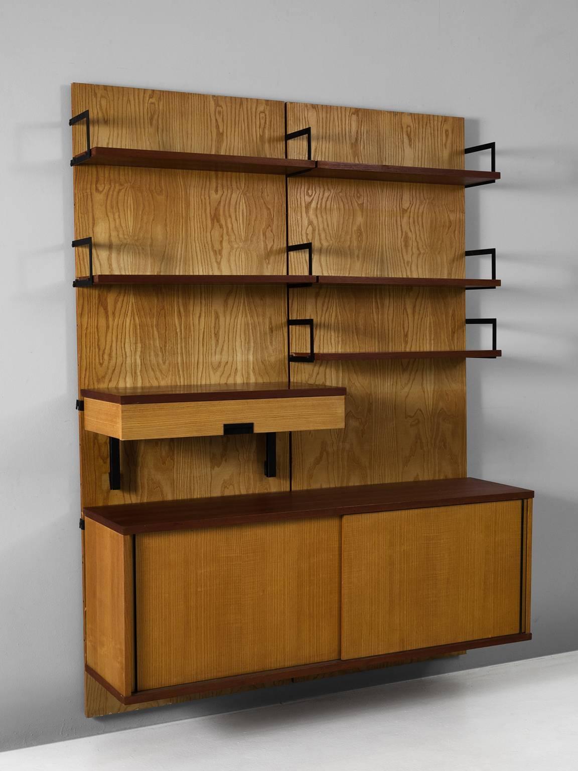 Modular wall-unit, in teak, maple and metal, by Cees Braakman for UMS Pastoe, the Netherlands, 1958. 

Modular wall cabinet from the Japanese series of Cees Braakman for Pastoe. Divided over two panels, these shelves could be arranged to your own