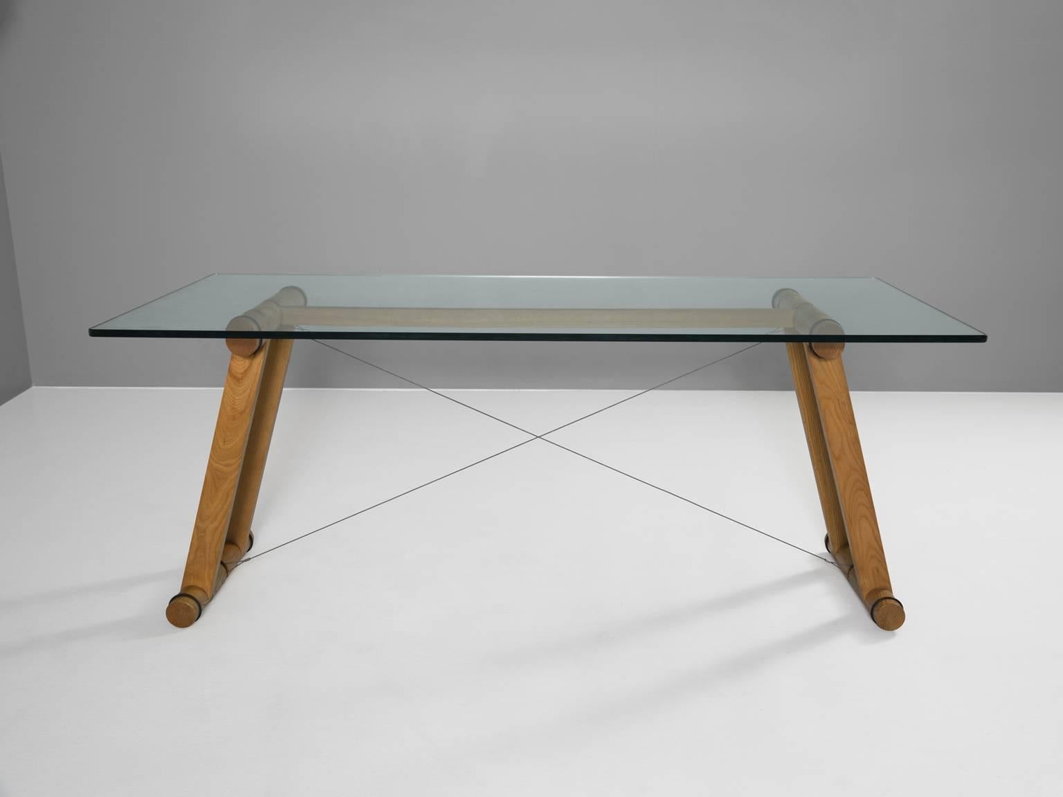 Table, in oak, metal and glass, by Superstudio, Italy, 1970s. 

Exceptional table by the Italian architects of Superstudio. Rare example with wooden base. The rectangular table has a clear glass top. The frame consists of four large tubular legs