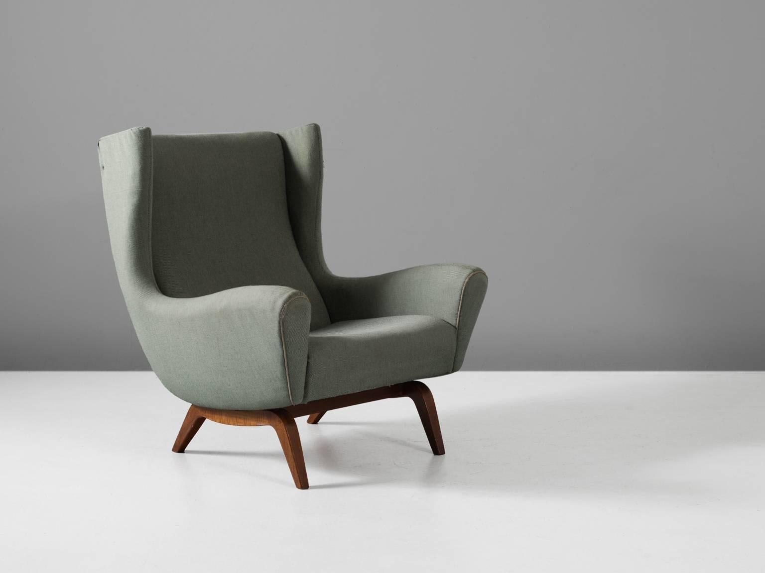 Lounge chair model 110, in teak and fabric by Illum Wikkelsø for Søren Willadsen, Denmark, 1950s.

This well-designed armchair shows an unusual elegance and great eye for detail, combined with outstanding craftsmanship, which is characteristic for