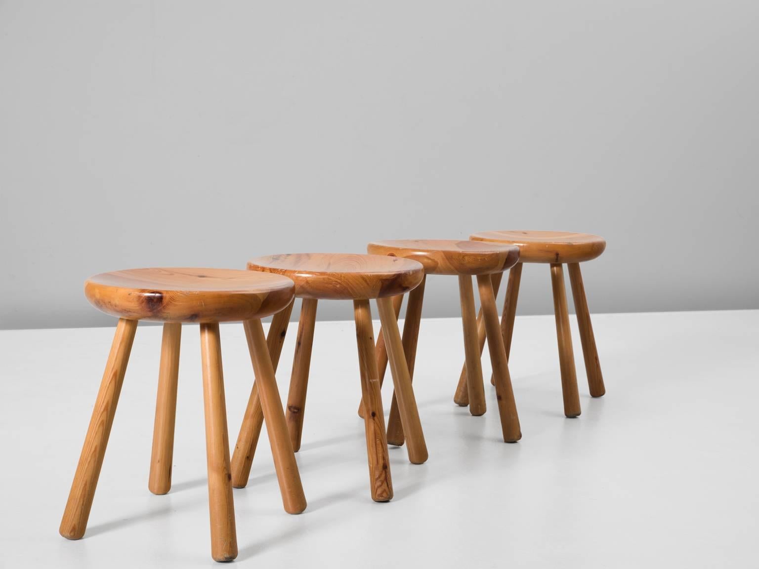 Set of four stools, in pine, Europe, 1970s. 

Set of four stools in solid pine, that are modest, raw and functional. A simplistic design which shows the nice and expressive grain of the pine wood. These chairs show great resemblance to the designs