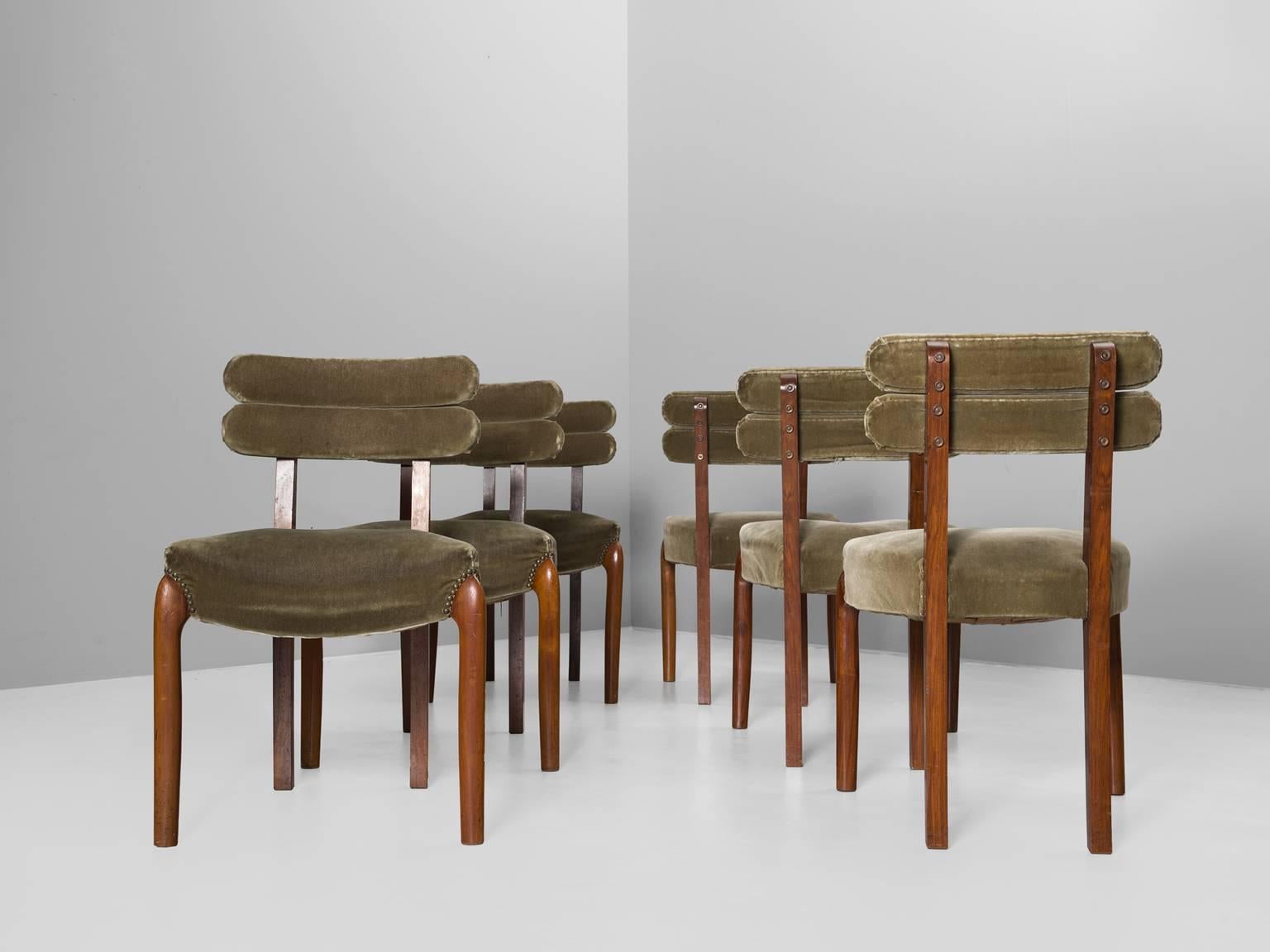 Set of six dining chairs, in walnut and fabric, Europe, 1930s.

Set of six elegant Art Deco dining room chairs in the style of Gaston Poisson and Charles Dudouyt. These chairs show beautiful details in wood and brass. The back is slightly curved