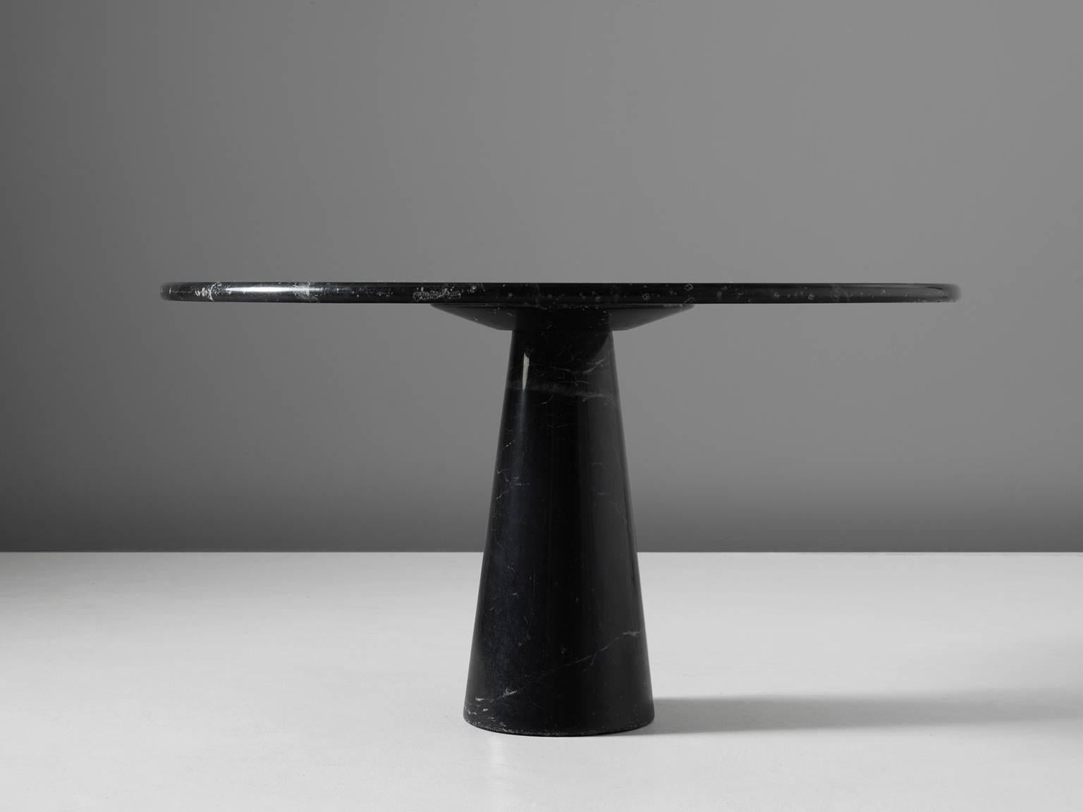 Dining table, travertine, 1969 by Angelo Mangiarotti and made by the company T 70, Italy. 

Angelo Mangiarotti (1921–2012) was an Italian architect and Industrial designer with a reputation to mainly focus on the needs of the users of furniture. His