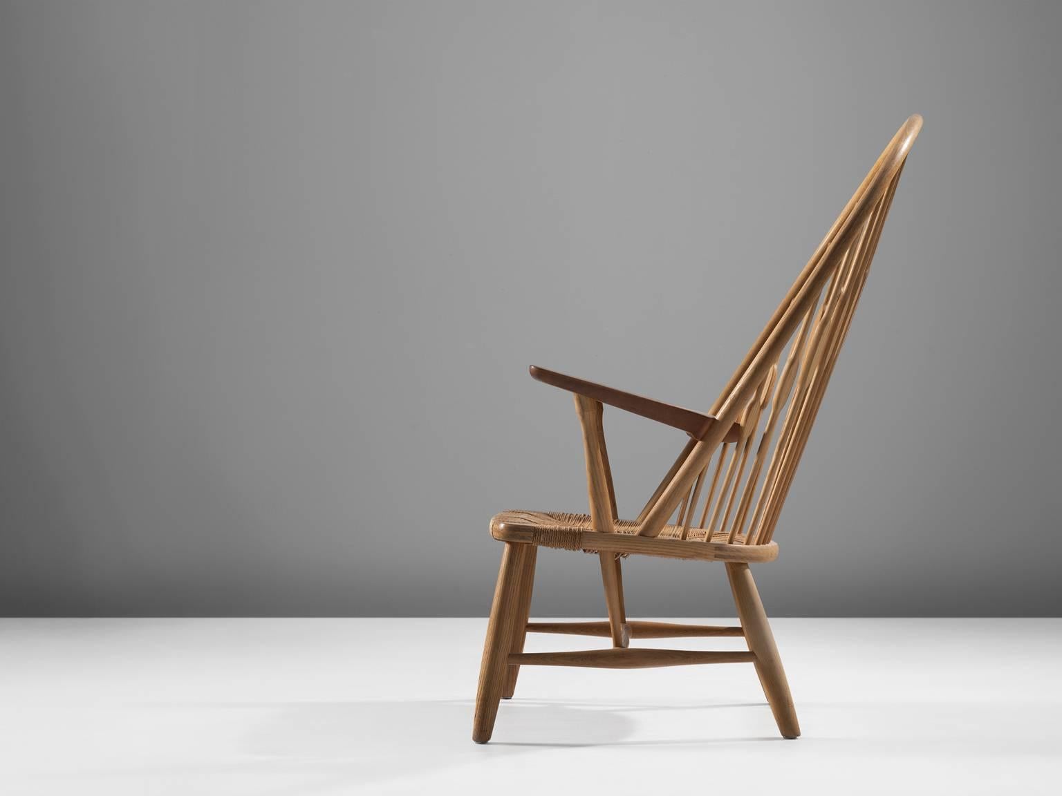 Chair, oak and rope 1947 (original design), Denmark.

The peacock chair, officially named JH550 is designed by Hans J. Wegner (1914-2007) together with Nils Thomsen in 1947. Thomsen states that they made the initial chair just for fun at first. The