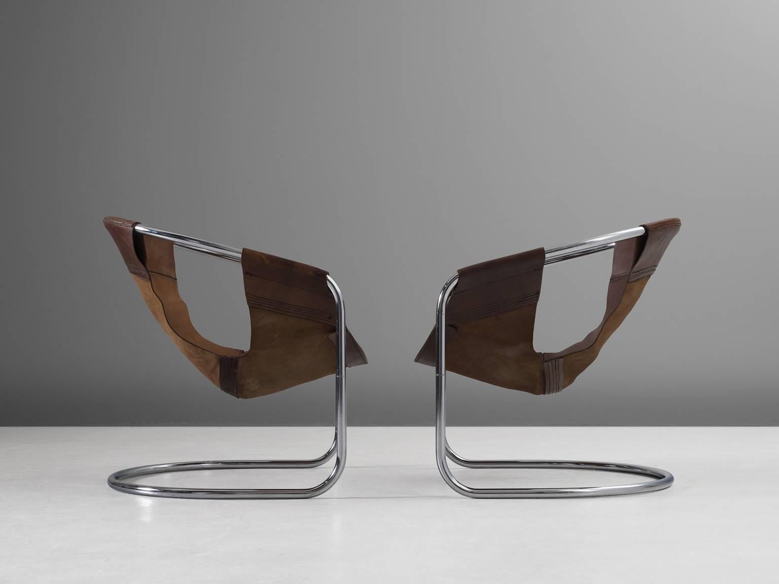 Chairs, leather and chrome, 1965, The Netherlands.

These two brown leather chair are both geometric and rustic in its style. The lounge chair was designed by Clemens Claessen for Ba-as Eindhoven, Holland, 1965. The chairs were designed by