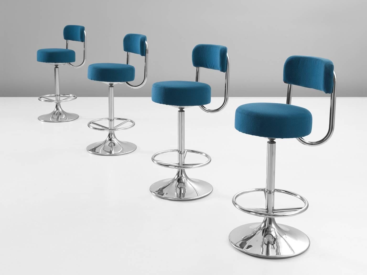 Bar stools, blue upholstery and metal, 1970s.

This set of four bar stools by Johanson is both comfortable and functional at the same time. The chairs are small in width yet still support the back. The main feature of this design is the curve in the
