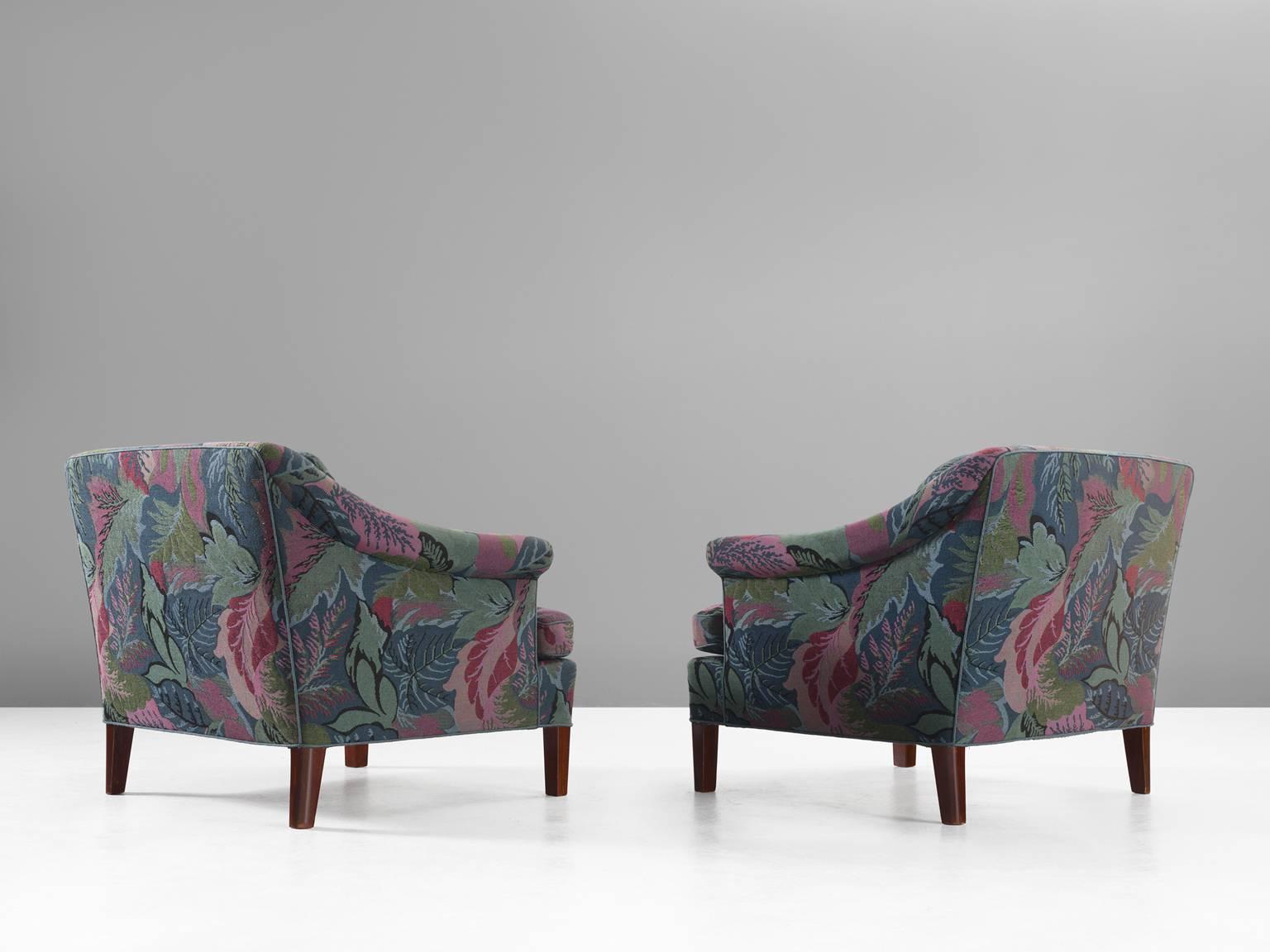 Lysberg Hansen & Therp, sofa three-seat, fabric and wood, Lysberg Hansen & Therp, Denmark, 1970s.

These two voluptuous floral and leaf chairs are robust and elegant at the same time. The sofa appears strong and solid yet the detailing on the back