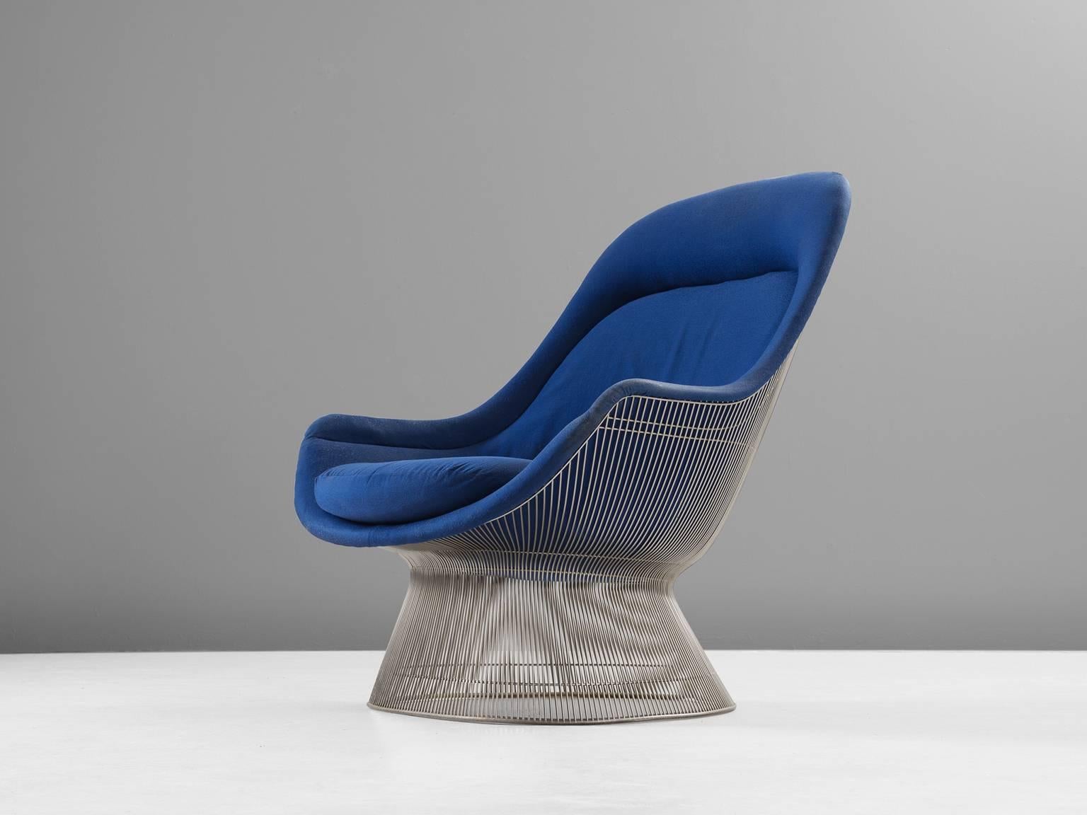 Warren Platner, lounge chair in metal and fabric, 1980s (design 1966), United States. 

This iconic blue easy chair by Warren Platner (1919-2006) is created by welding curved steel rods to circular and semi-circular frames, simultaneously serving