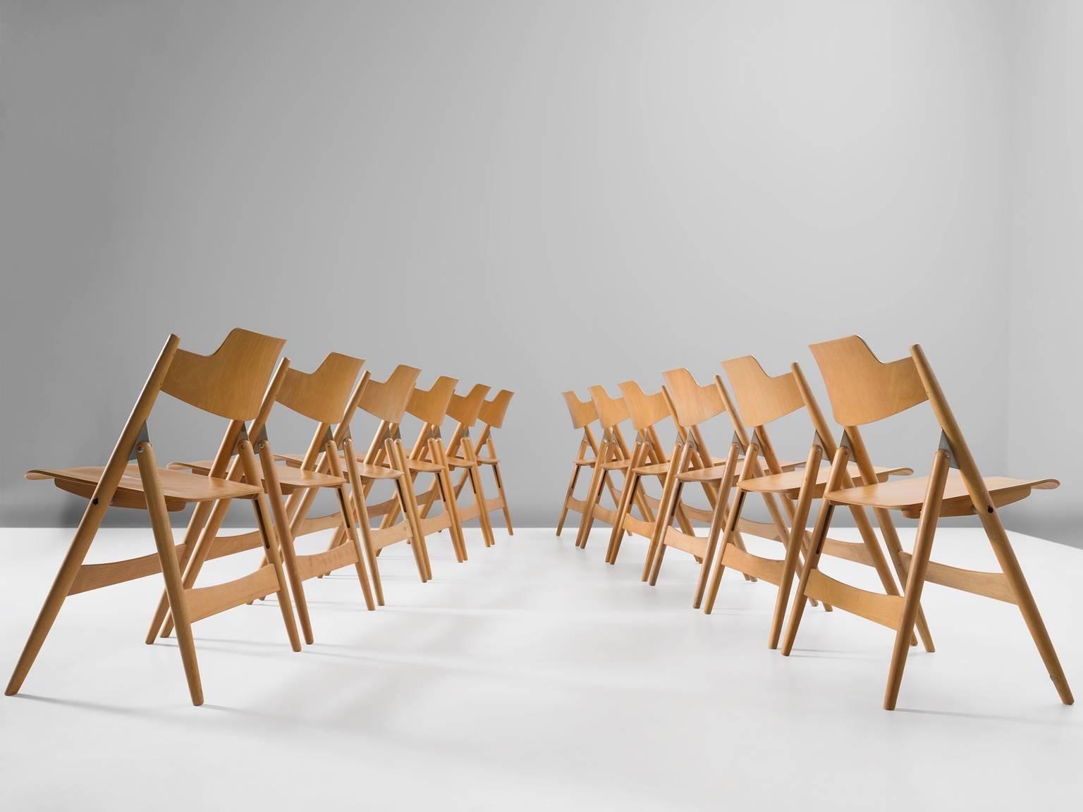 Set of twelve foldable chairs in beech by Egon Eiermann, 1960, Germany.

These folding chairs were designed in 1952 by Egon Eiermann (1904-1970) for Wilde & Spieth. The chairs are extremely functional and simple in their design, they can be