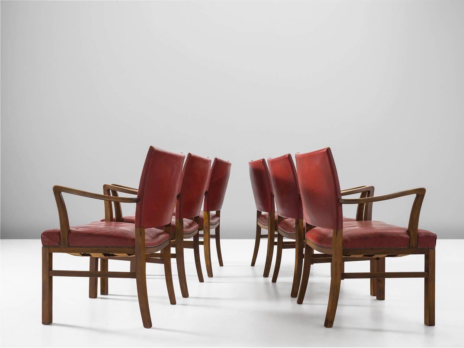 Armchairs, red leather and beech, 1930s, Denmark.

These red patinated armchairs atrributed to Jacob Kjaer (1896-1957). The style of these chairs is formal and robust and is in the line of the designs of Kaare Klint. The leather is attached to the