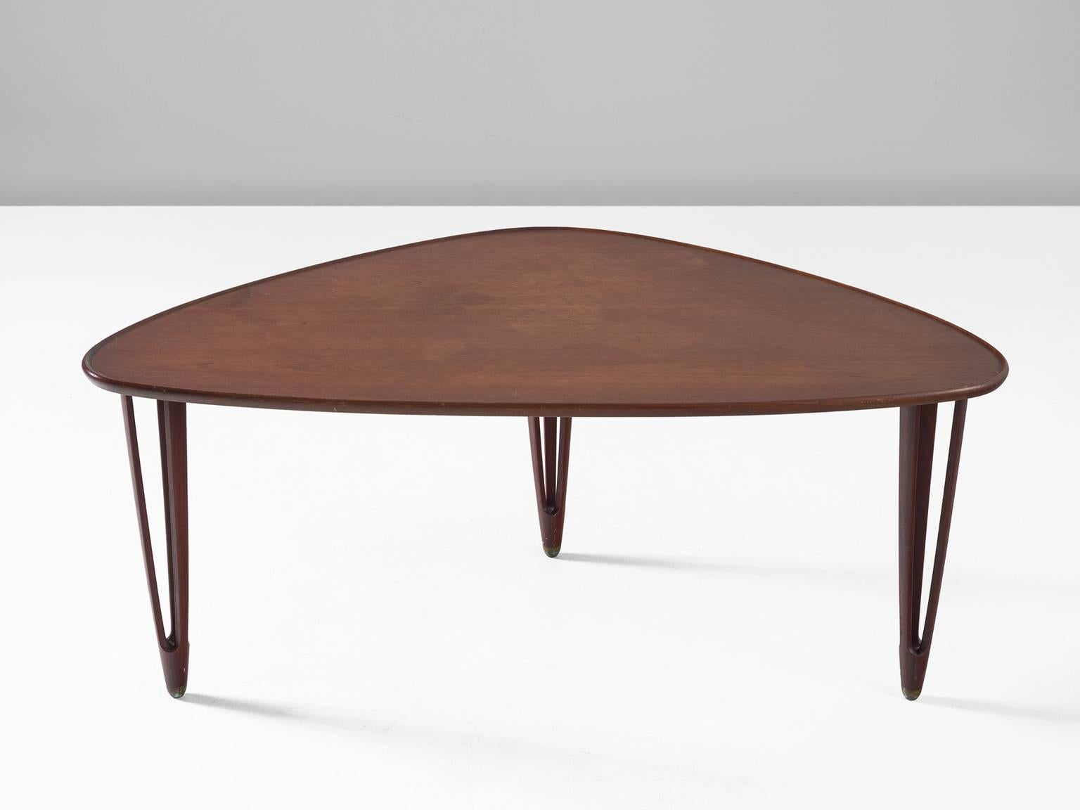 Coffee table, teak, B.C. Møbler, Denmark, 1950s. 

This graceful asymmetrical tripod coffee table made from teak with rounded edges and brass feet is produced by Danish company B.C. Møbler in the 1950s. The side table is exemplary for Scandinavian