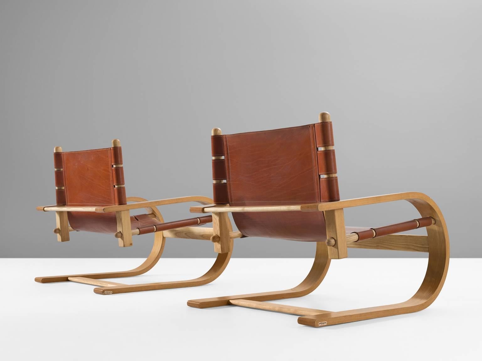 Gionathan de Pas, Donato D’Urbino and Paolo Lomazzi, Lounge chair, Modell Scacciapensieri, Italy, 1976.

These two cantilever chairs have plywood frames and distinct cognac leather. These chairs, designed by Polotronova are iconic pieces from