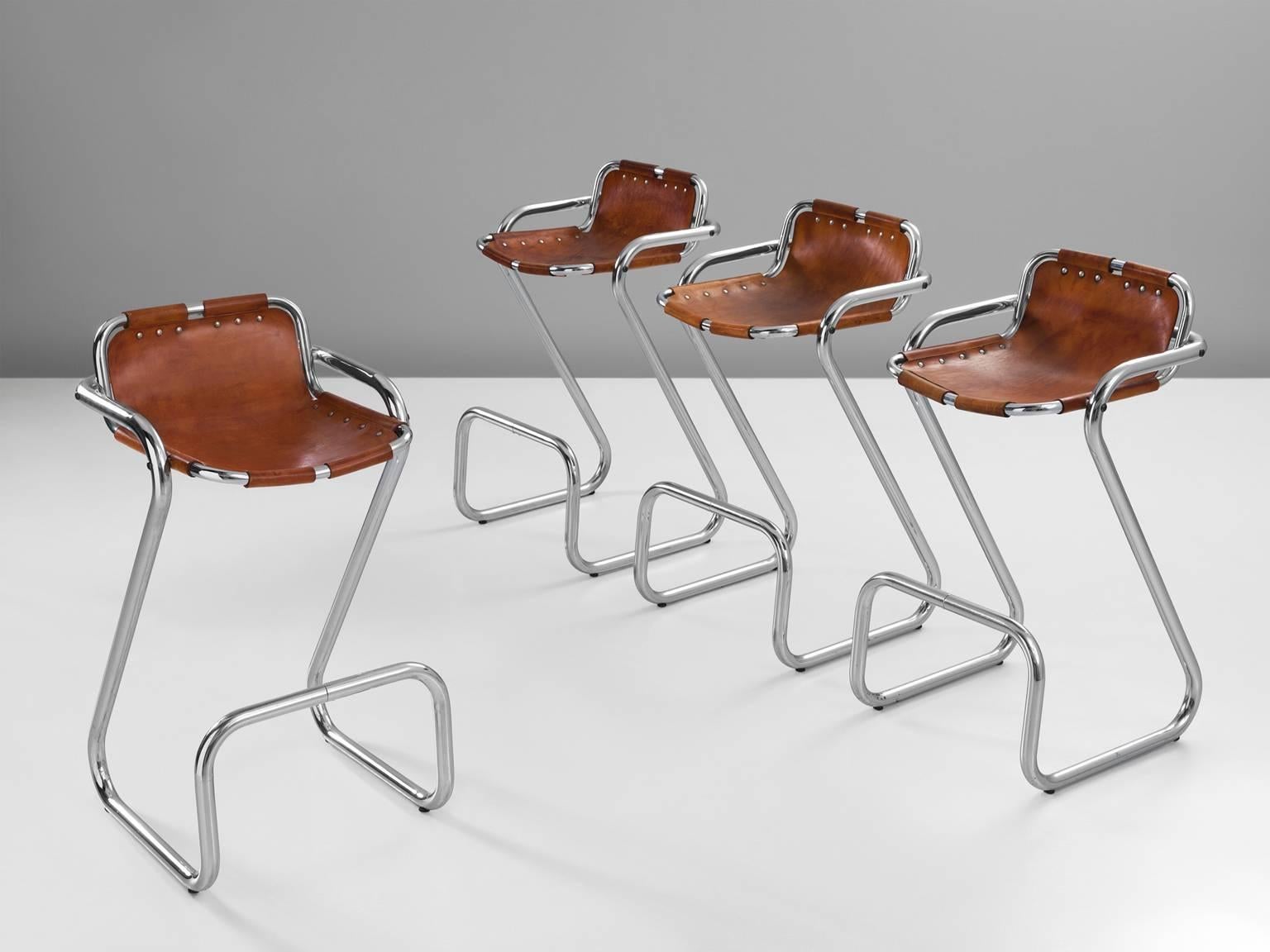Set of four tubular bar stools, in steel and leather, selected by Charlotte Perriand, France, circa 1970s. 

Set of four stools of the famous model 'Les Arcs' which were selected by French architect and designer Charlotte Perriand. The