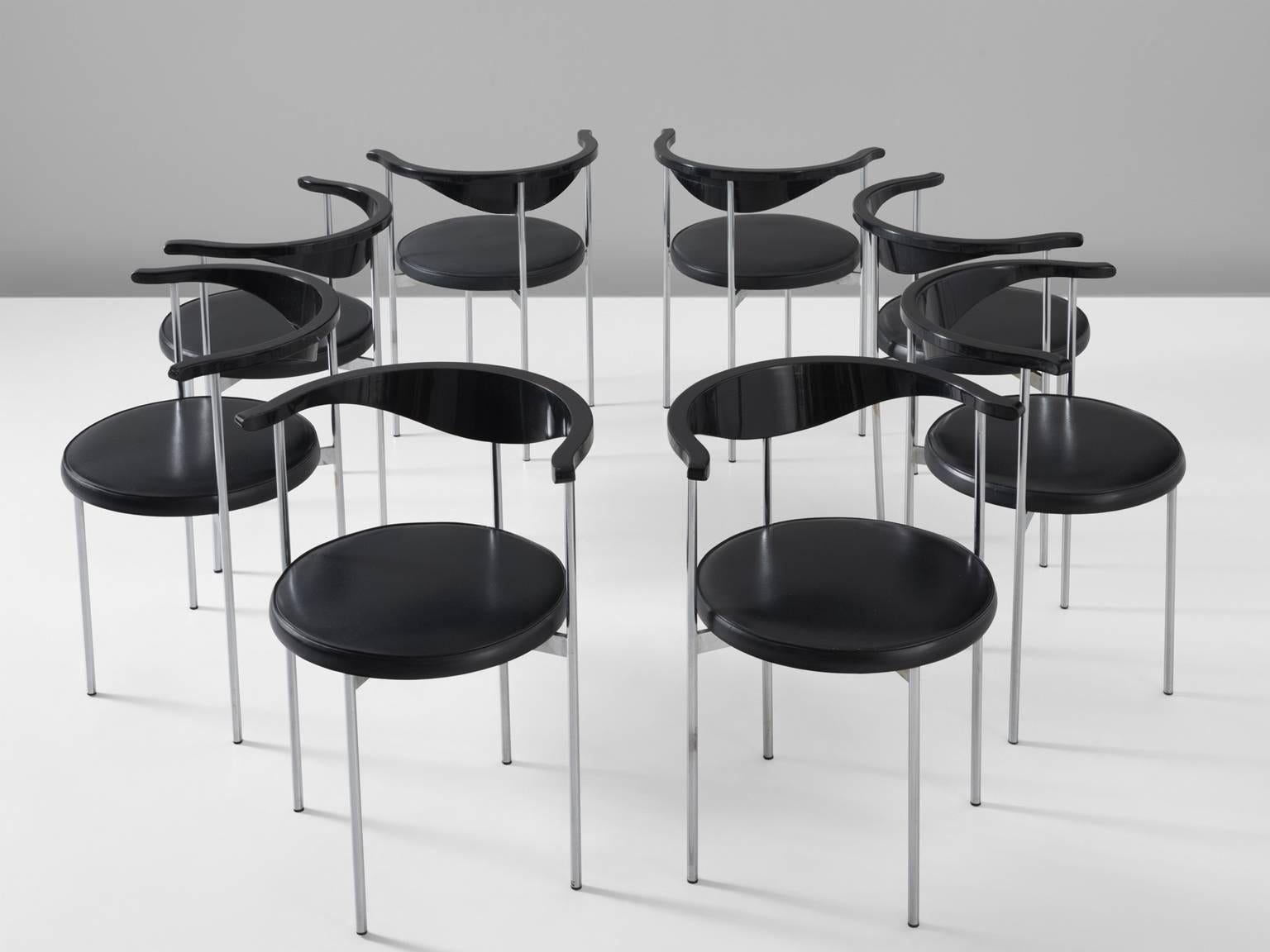 Set of eight Frederik Sieck chairs, skai and metal, Denmark, 1960s.

These Industrial clear set of the model 3200 chairs were designed by the Swedish Frederik Sieck for Fritz Hansen. The round chair has a Classic outward curving toprail. The chair