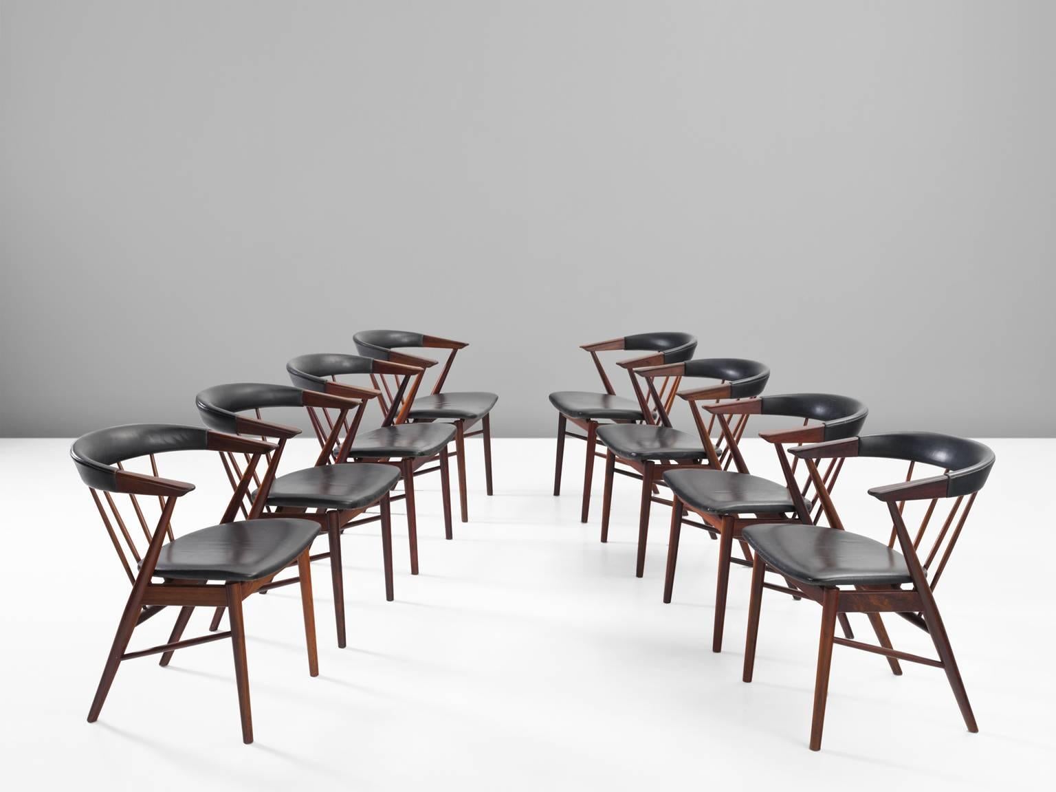 Chairs, rosewood and leather, Denmark, 1950s.

These chairs by Helge Sibast (1908-1985) for Sibast Furniture exhibit a distinct cantilevered seat with a bent backrest. The back is supported with a series tapered spindles. The back legs taper into