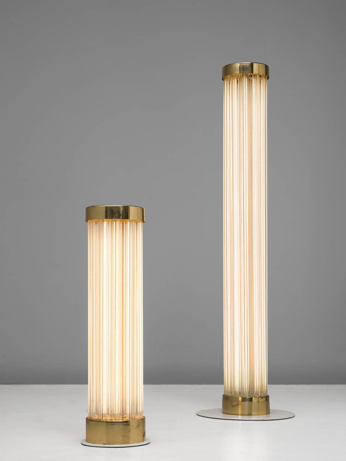 Floor lamps, brass and glass, Italy, 1960s.

These two wonderfully simplistic floor lamps are very pure in their design. The core of these lamps are the TL lights which is what the rest of the design is based on. The bottom and top are finished