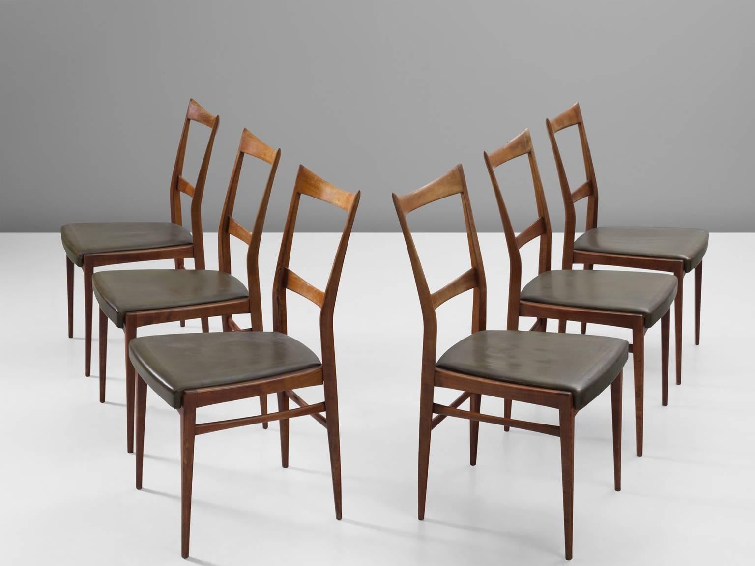 Six chairs, leather and walnut, Scandinavia, 1950s.

These slender, elegant dining chairs are a truly exquisite example of craftsmanship. Especially the backs of these chairs are extremely well-made. They are delicate, airy and match wonderful with