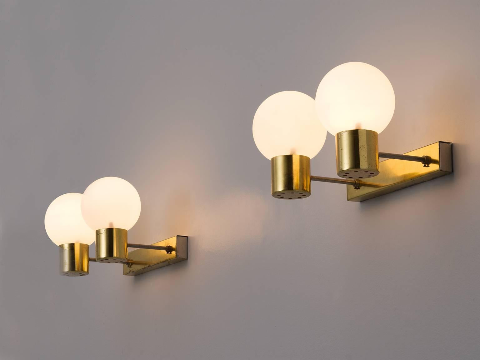 Wall lights, brass and opaline glass, Europe, 1960s. 

Wonderful set of solid brass frames with opaline glass shades with a matte white finish. These wall scones have a very natural light partition and elegant shaped glass. They are the perfect