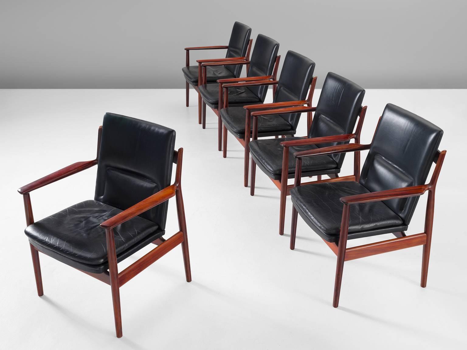 Armchairs, model 431 by Arne Vodder for Sibast in Denmark, 1960s.

Elegant set of six chairs in original black leather by Danish designer Arne Vodder. These chairs show the great craftsmanship of Arne Vodder. The seating and back show a simple and