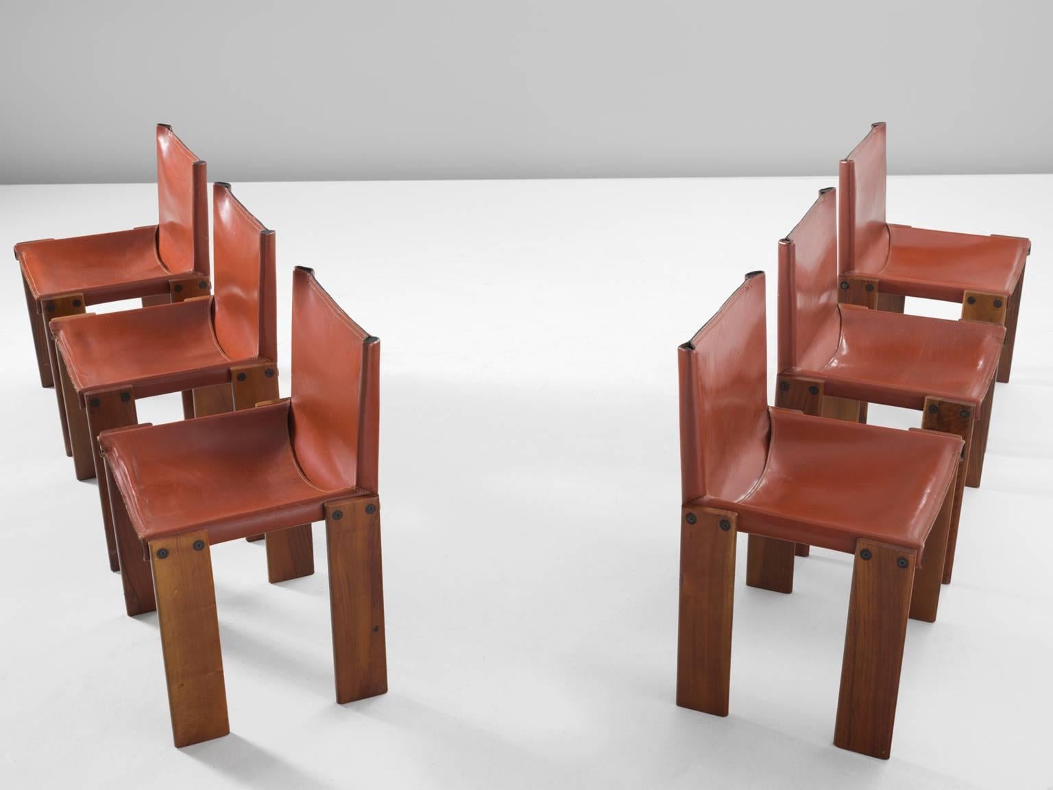 Dining chairs by Arfa & Tobia Scarpa, oak and Sienna red leather, Italy, 1974.

These rare six chairs are strong and sturdy in their design. The wonderfully warm leather is very wel suited to the patinated oak. Interesting is the 'flat' shape of