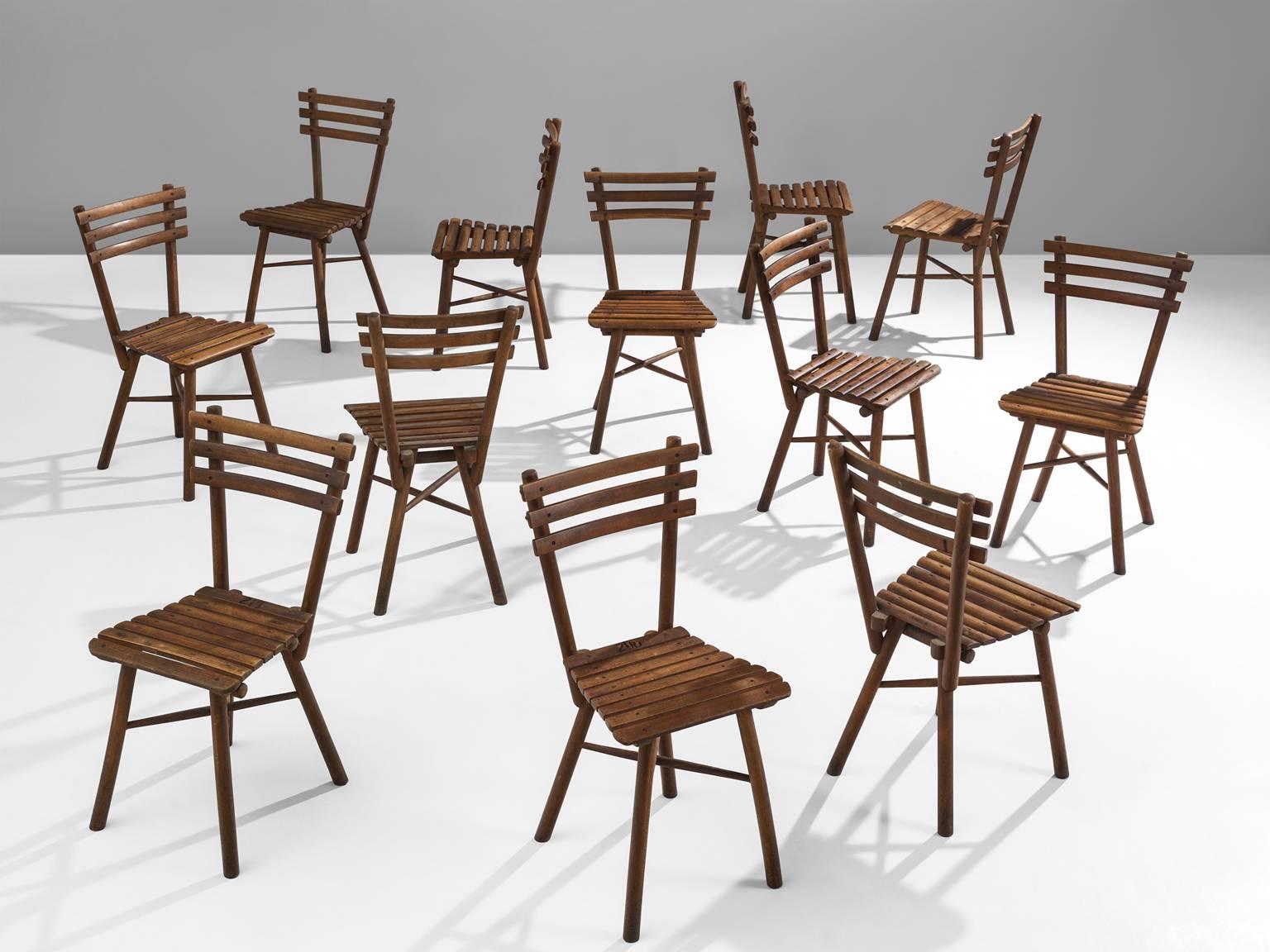 Set of twelve Thonet garden chairs in beech by, J. &;J. Kohn 'Nr. 4', circa 1910.

This large set of Thonet chairs are executed by J.&J. Kohn. These chairs have slats as their main feature and their legs are connected with a crossed base. Michael