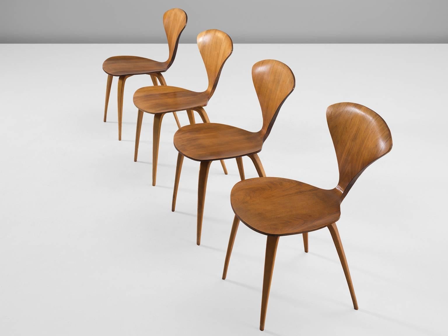 Set of four dining chairs, in walnut and plywood, by Norman Cherner for Plycraft, United States 1957.

These four classic Norman Cherner plywood chairs date from 1957. Their iconic shape resembles something like a delicate butterfly, yet do not be
