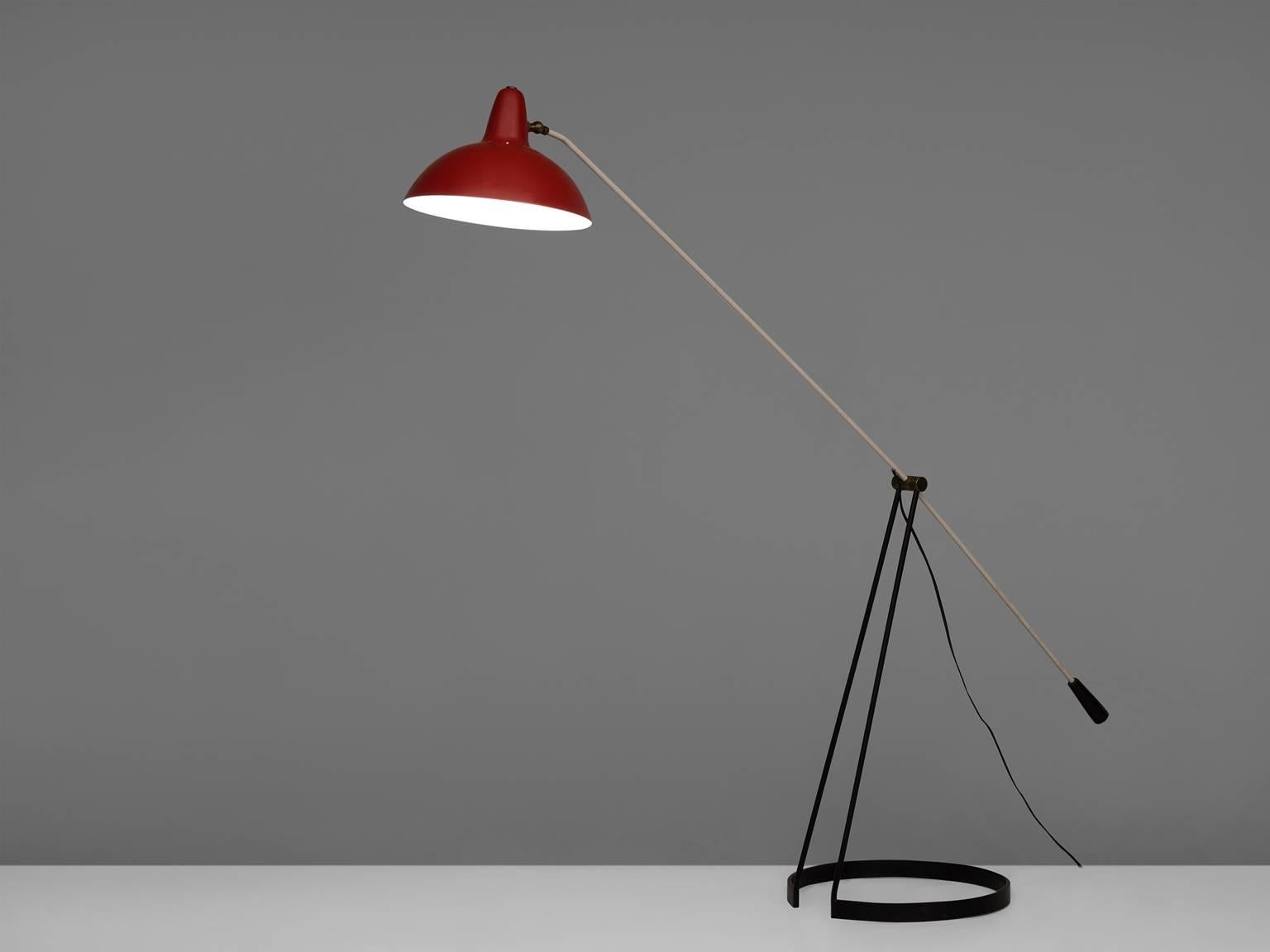 Tivoli Grasshopper floor lamp, black painted metal floor lamp with dark red shade by Floris Fiedeldij, The Netherlands, 1956. 

This quirky lamp with round base open from the fifties is designed by Floris H. Fiedeldij for Artimeta. The lamp, with