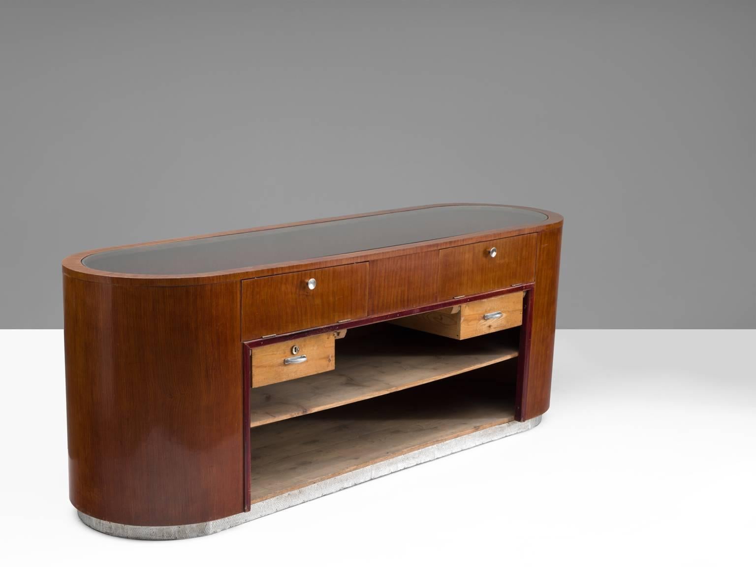 Sideboard in teak and glass, Denmark, 1950s.

This organic shaped counter is versatile. It can be used as a dry bar, as a cabinet, counter or credenza. Wonderful warm grains of the mahogany and slick chrome handles form a wonderful contrast. 