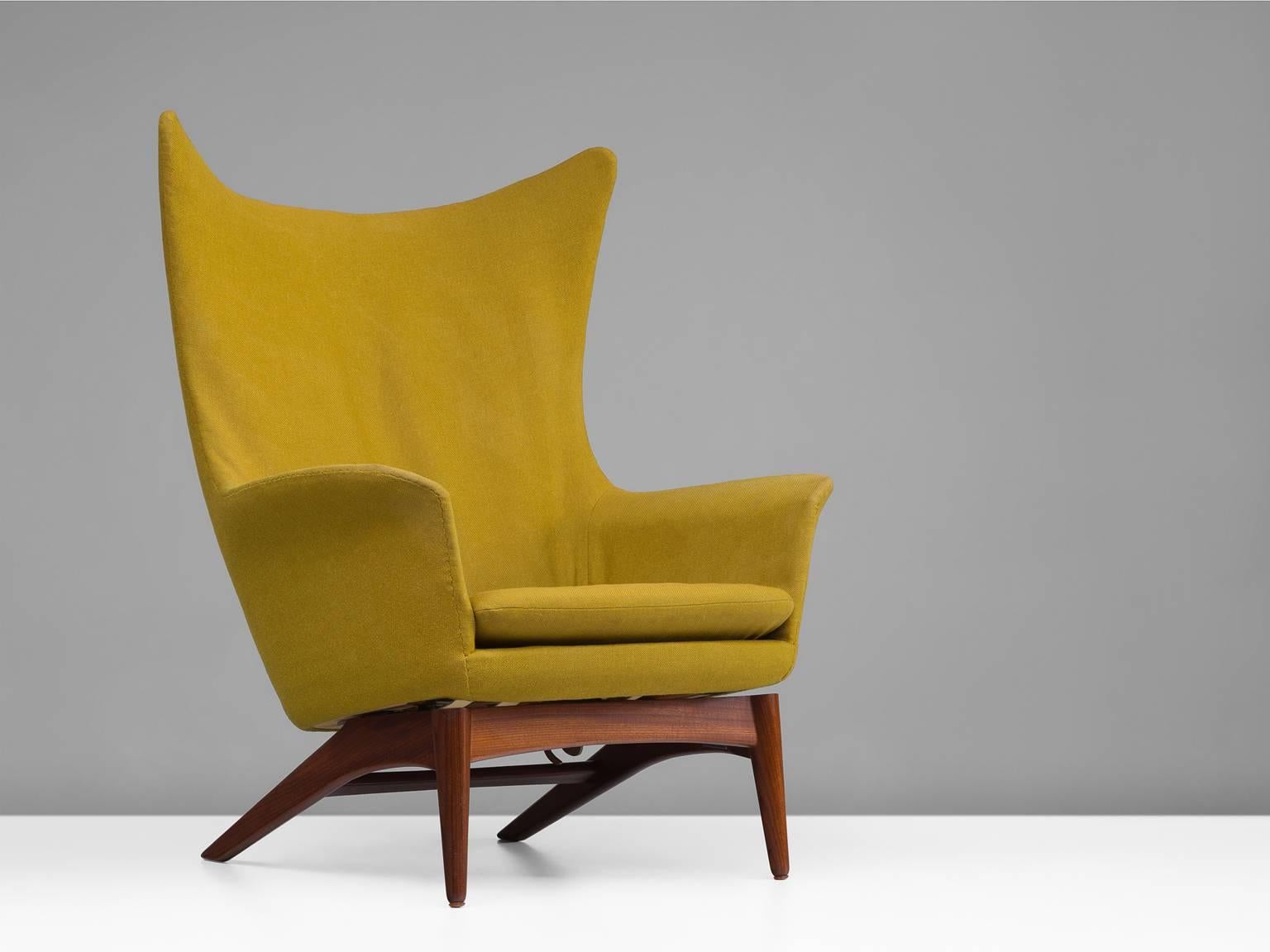 Easy chair model 207. Teak base wit tilt function. Seat and back upholstered in wool, produced by Bramin-Møbler, N. A. Jørgensens Møbelfabrik, Denmark, 1950s

This yellow upholstered armchair is archetypical for Mid-Century Danish design. The teak