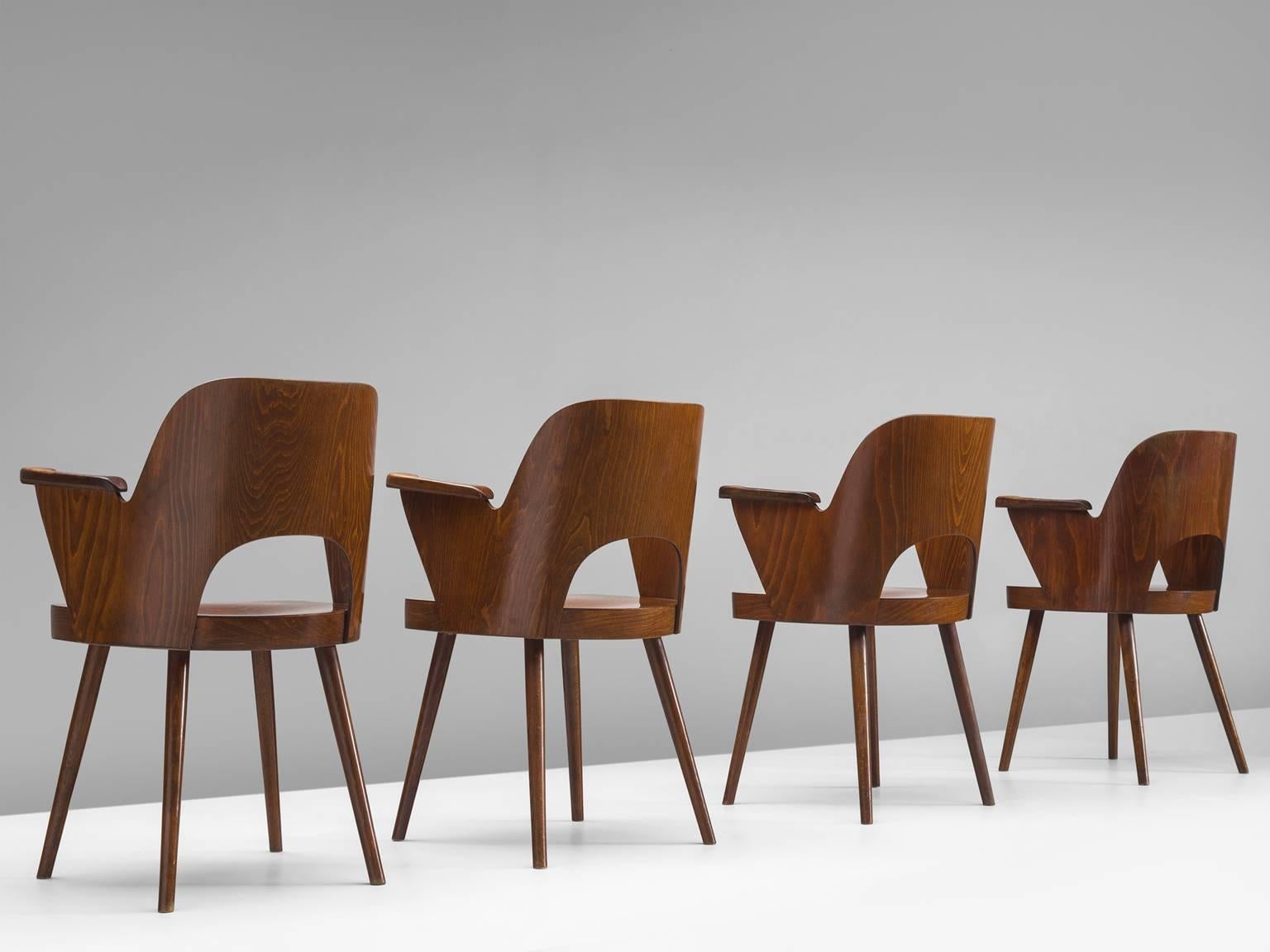 Set of four armchairs, in beech by Oswald Haerdtl for Thonet, Czech Republic, 1955.

Set of four bended plywood armchairs in beech. These chairs were designed by Oswald Haerdtl for the famous bentwood manufacturer Thonet. These chairs show nice