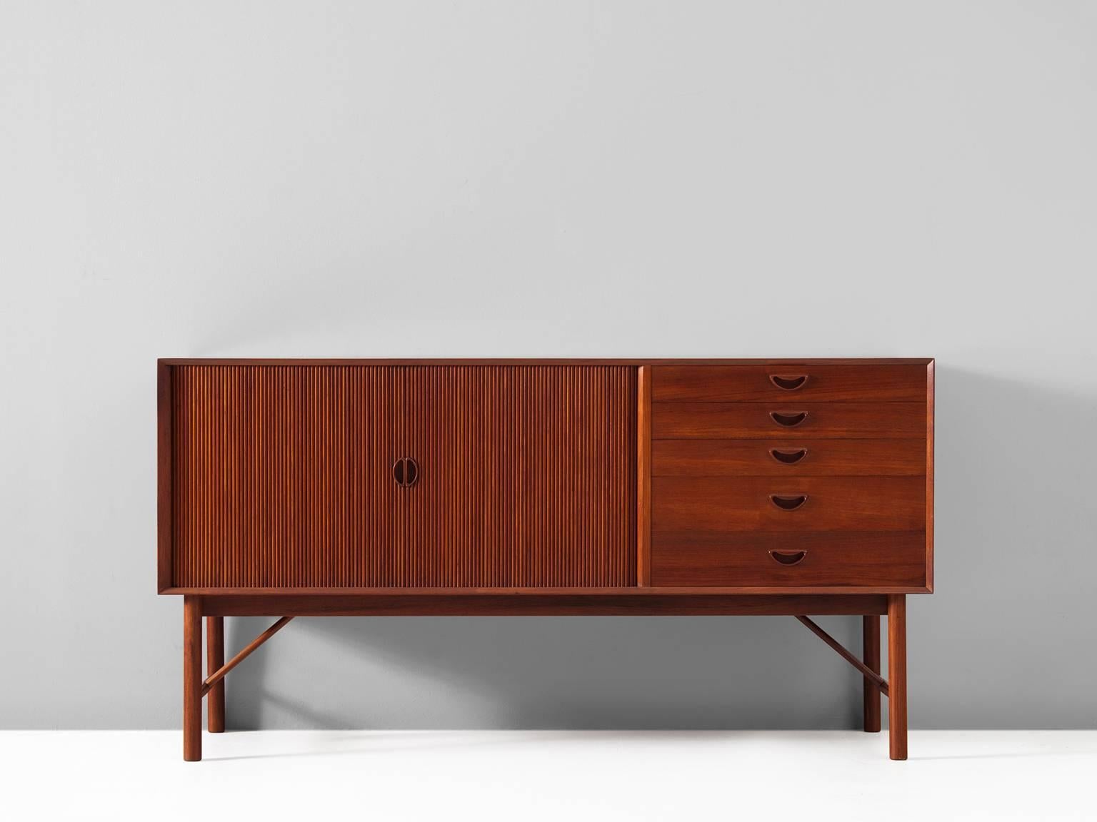 Credenza, teak by Peter Hvidt and Orla Mølgaard Nielsen, Denmark, 1950s.

High quality and Fine designed credenza in teak by Danish designer duo Peter Hvidt and Orla Mølgaard Nielsen. This cabinet shows beautiful detailed tambour-doors. The duo's