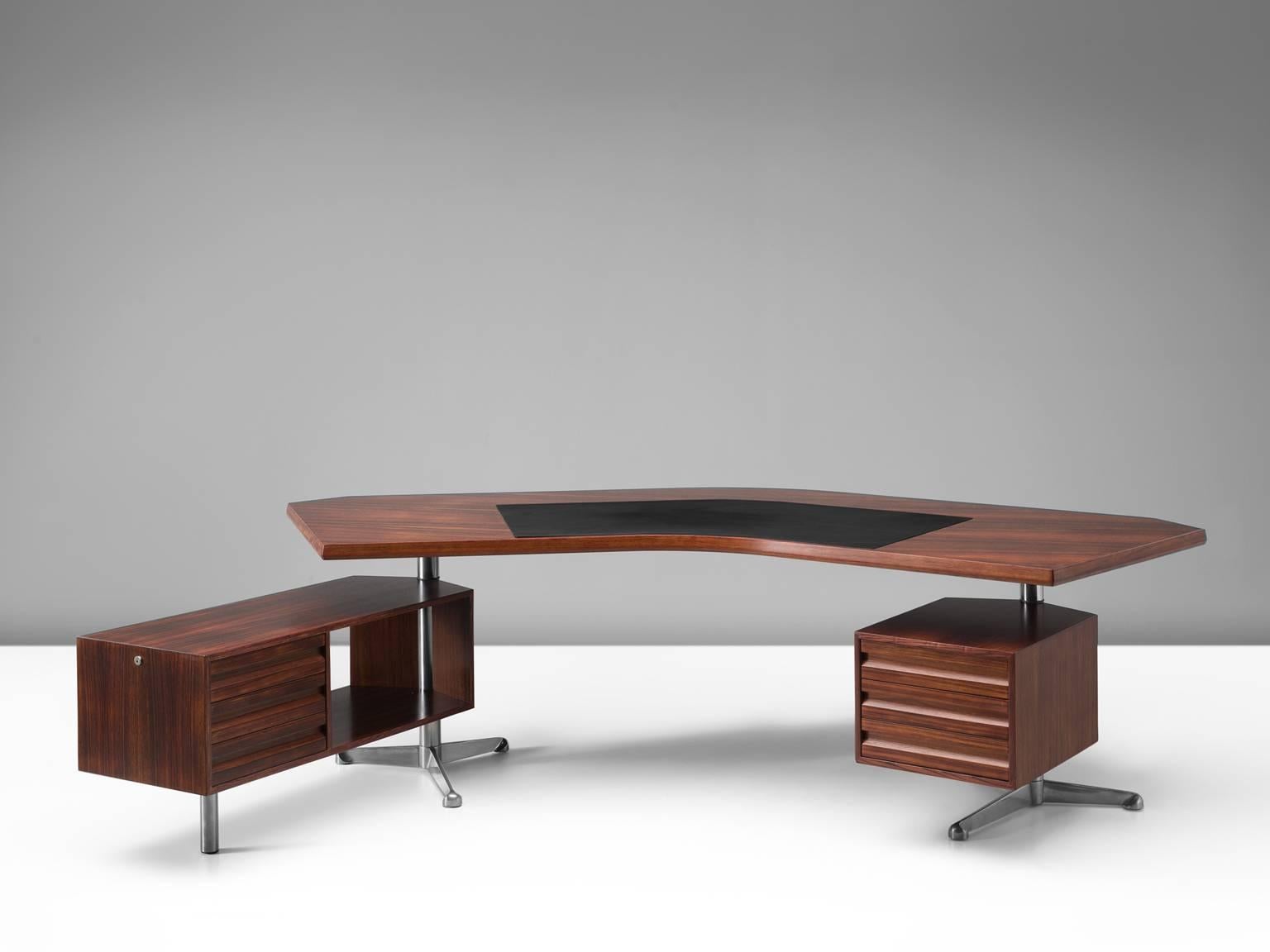 Desk T-96 'Boomerang', in rosewood and metal, by Osvaldo Borsani for Tecno, Italy, 1956. 

This version Boomerang desk by Osvaldo Borsani is executed in rosewood and includes a new black leather writing pad. The two revolving cabinets are held in
