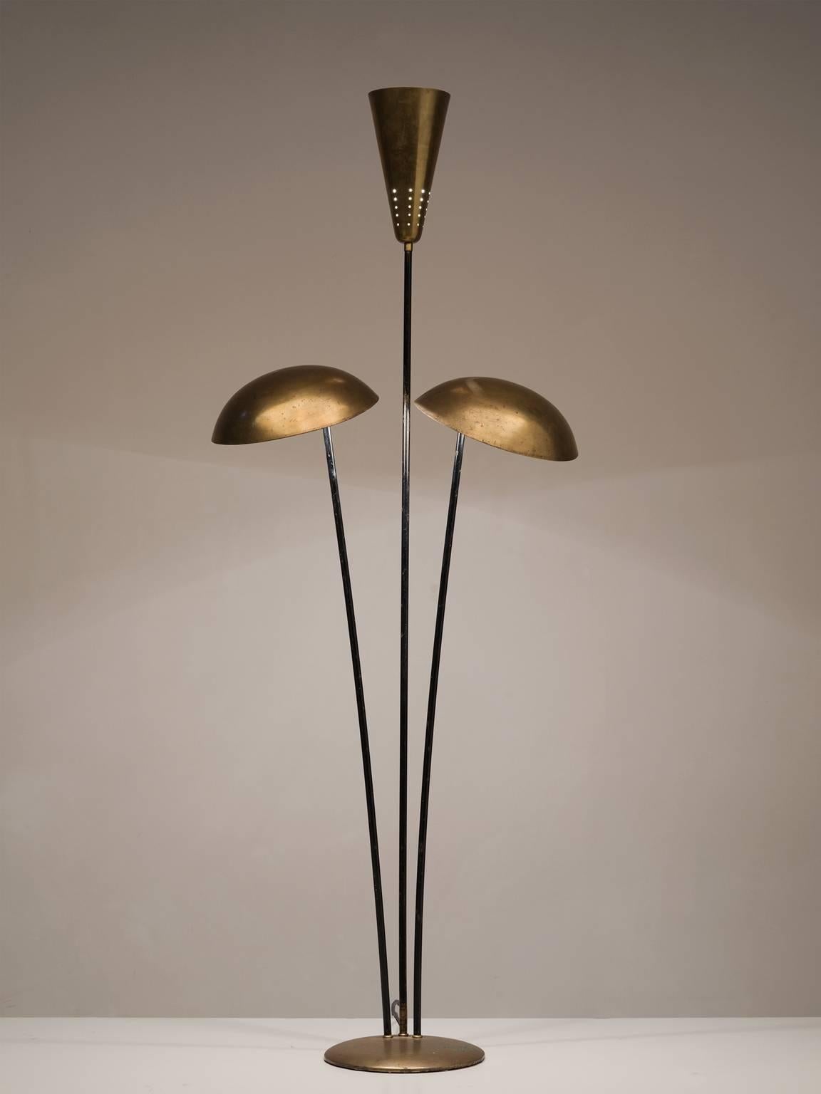 Floor lamp in metal and brass, Hildegard Liertz for Hesse-Lamps, Germany, 1970s. 

This playful floor lamp features three separate rods that lead to three brass lamp shades. The middle shade is cone shaped whereas the outer shades are bowl-shaped.