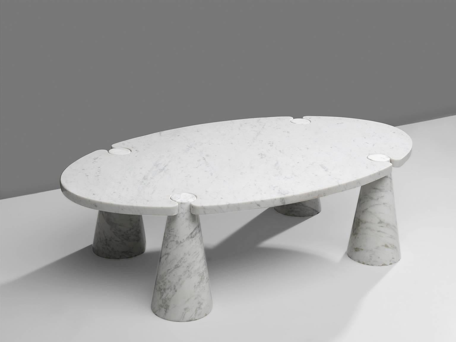 Cocktail table by Angelo Mangiarotti, marble, 1970s. 

This sculptural table by Angelo Mangiarotti is a skillful example of postmodern design. The oval table features no joints or clamps and is architectural in its structure. The table rests on