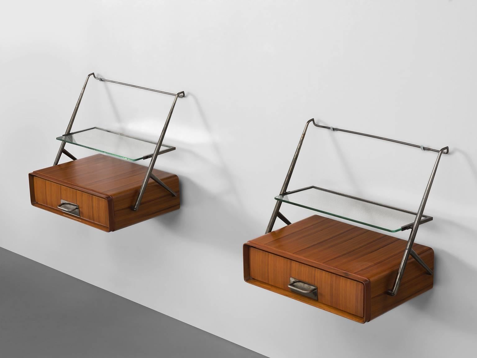 Nightstands by Silvio Cavatorta, maple, brass, glass, Italy, 1950s.

These two delicate bedside tables are designed by the Italian Silvio Cavatorta. The little cabinets feature one door in each maple compartment and on top a brass frame with a