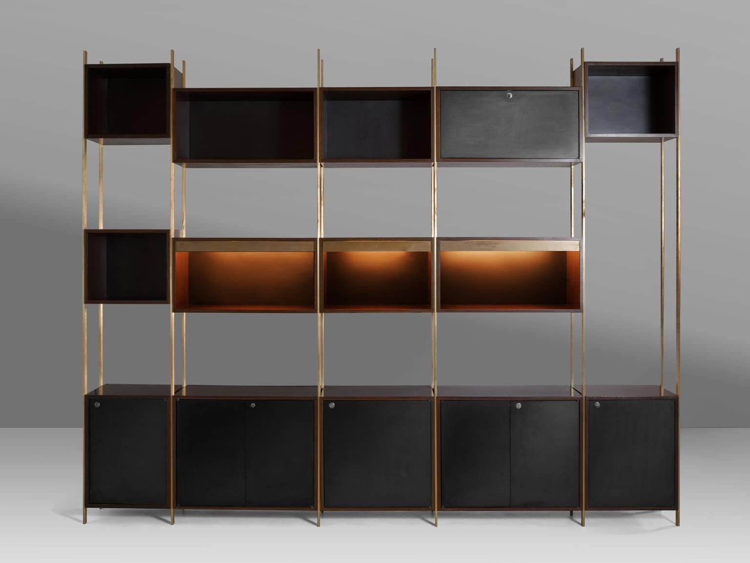 Bookcase, in brass and wood, by Jules Wabbes for Mobilier Universel, Belgium, 1960s.
 
Rare wall unit designed with the highest precision in furniture making by master furniture-maker Jules Wabbes. This cabinet could be used as a library and room