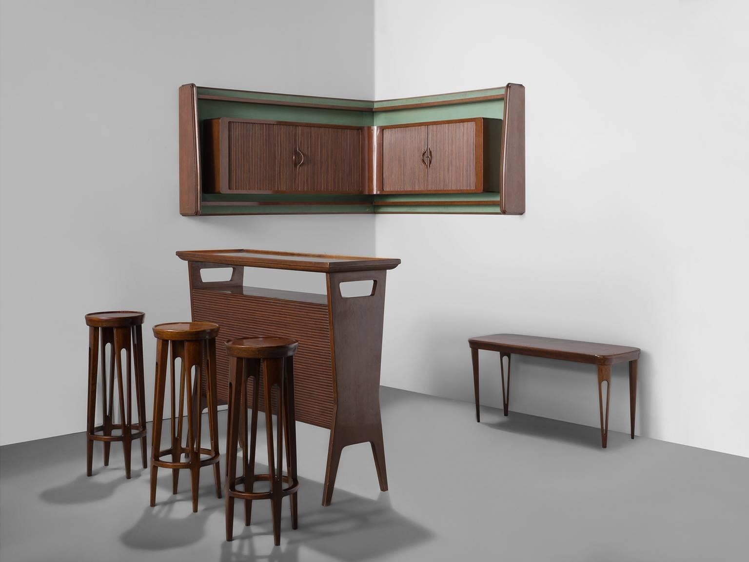 Bar set with stools, bar, side table and wall unit, Italy, 1950s. 

This elegant, playful set of bar furniture is executed in Italian walnut and shows typical Italian detailing in the tapered open legs, tambour doors and the diagonal lining. The set