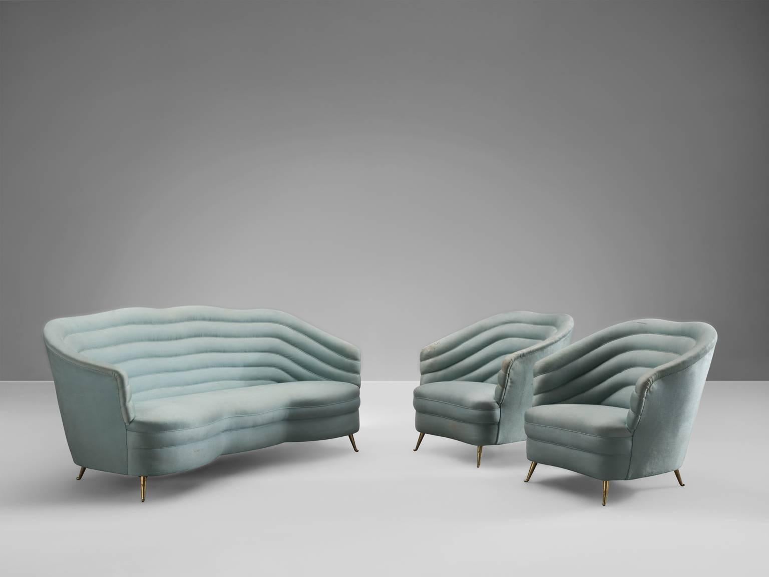 Set of lounge chairs and matching sofa in velvet and metal by Andrea Busiri Vici, Italy, 1960s. 

These elegant, voluptuous lounge chairs and sofa our now shown in an aquamarine, light-blue velvet. The term organic seems to be invented for this