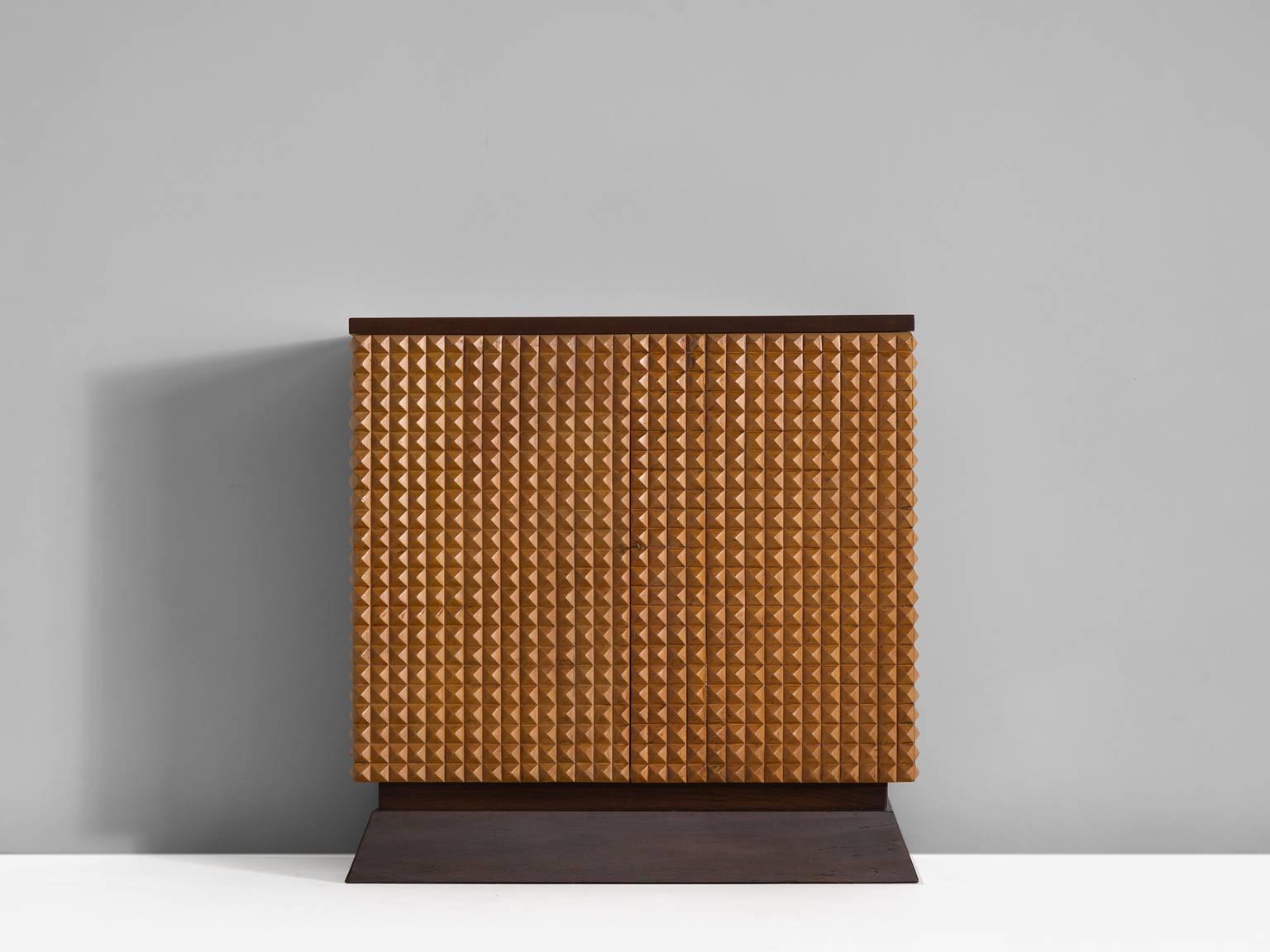 Credenza with graphical, crafted three dimensional door panels in lacquered wood. The two doors, each feature a triangle/pyramid surface which is crafted to perfection. The continuous pattern gives this cabinet a strong expression, emphasized by its