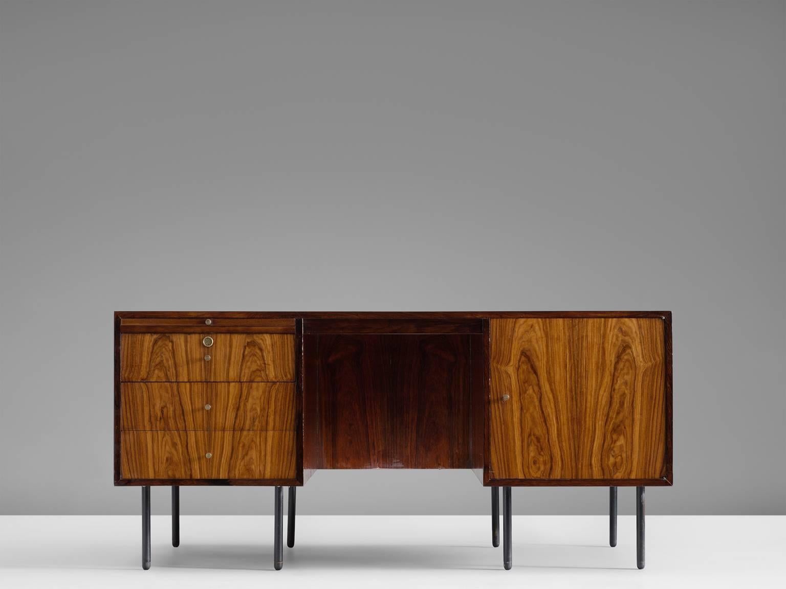 Executive desk, in rosewood and metal by Martin Eisler and Carlo Hauner, Brazil, 1960s.

Freestanding desk in rosewood by Brazilian designer duo Eisler and Hauner. Elegant writing desk designed with high attention to detail. The small cylindrical