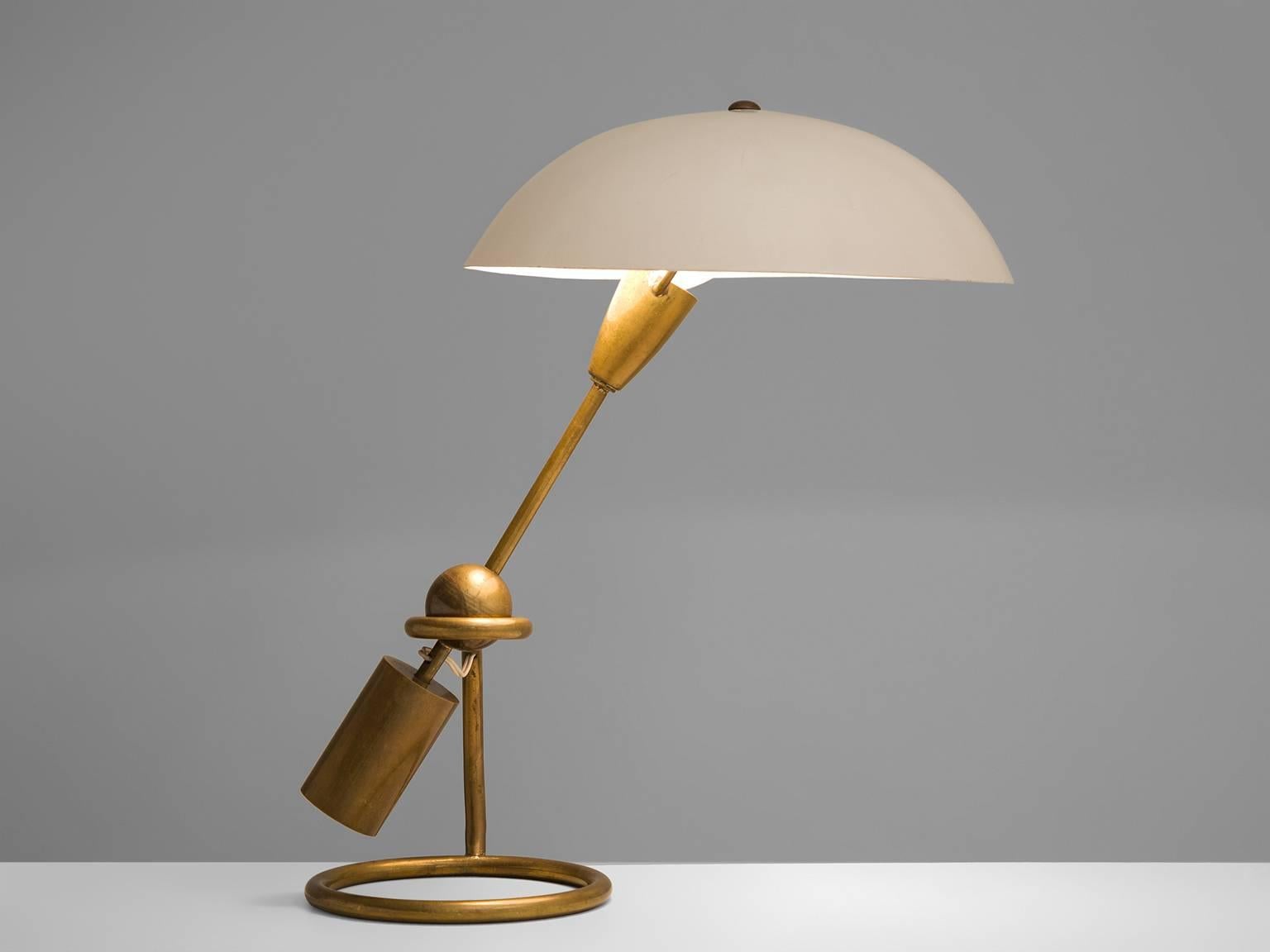 Table lamp, in brass and opaline glass shade by Angelo Lelli for Arredoluce, Italy, 1950s. 

Elegant desk light with admirable patinated brass body and opaline glass shade, designed by Angelo Lelii. The disc-shaped shade reflects a nice and